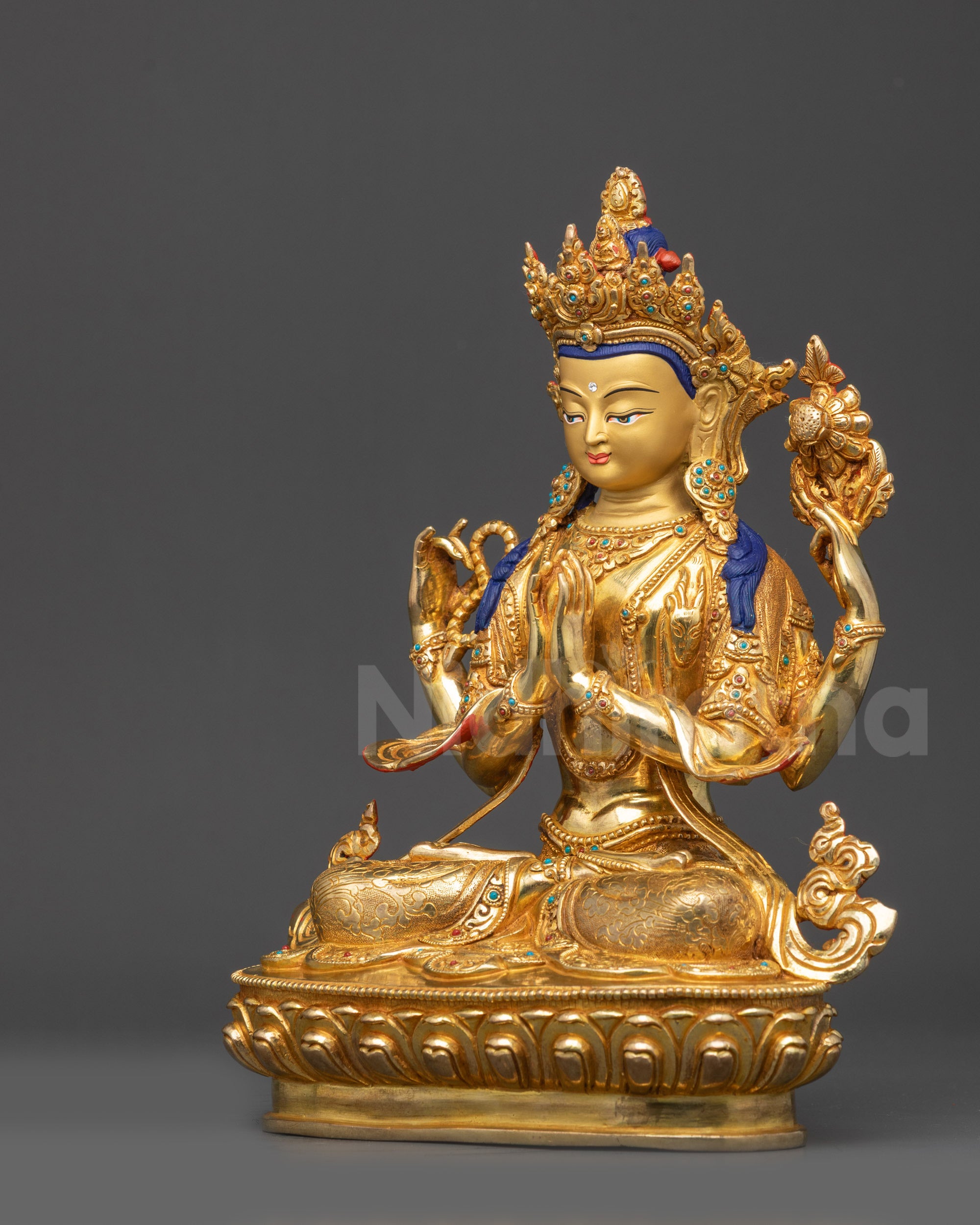 Left side view Chenrezig Bodhisattva sculpture showing gold-gilded copper details