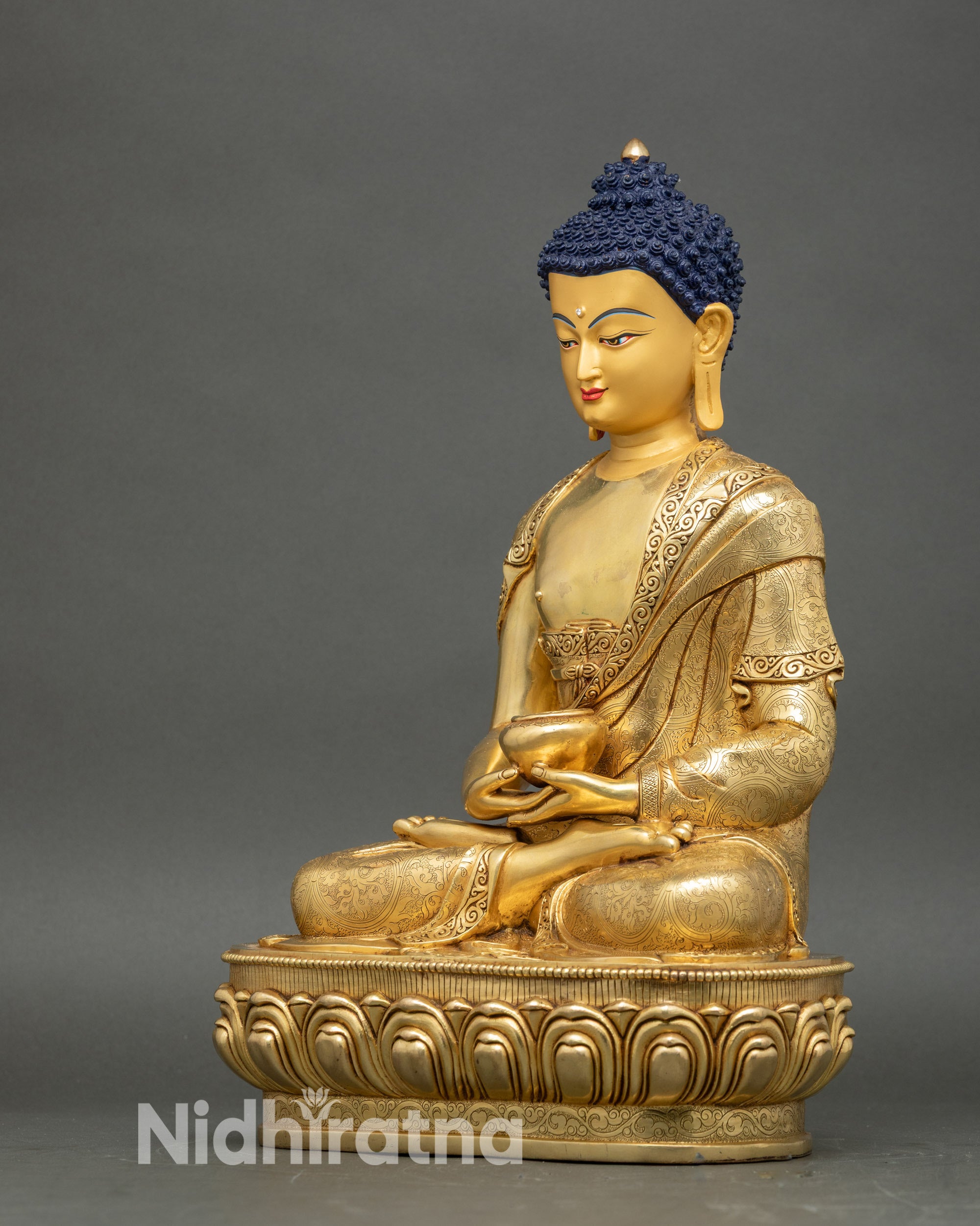 Left side view of Amitabha Buddha statue showing intricate robes and serene posture
