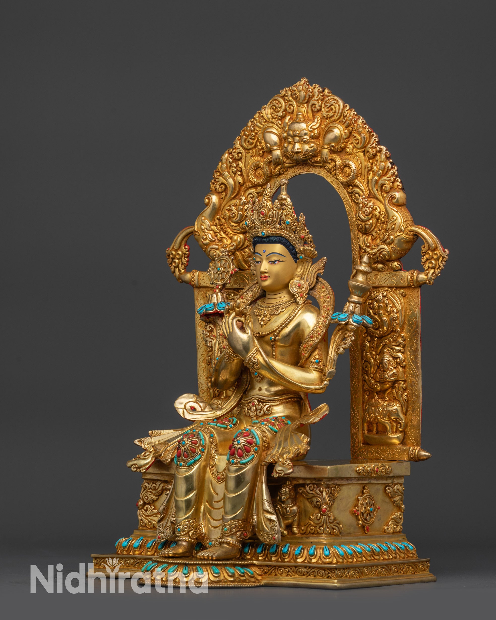 Left side view of Ariya Maitreya Buddha statue showing floral designs and lotus seat
