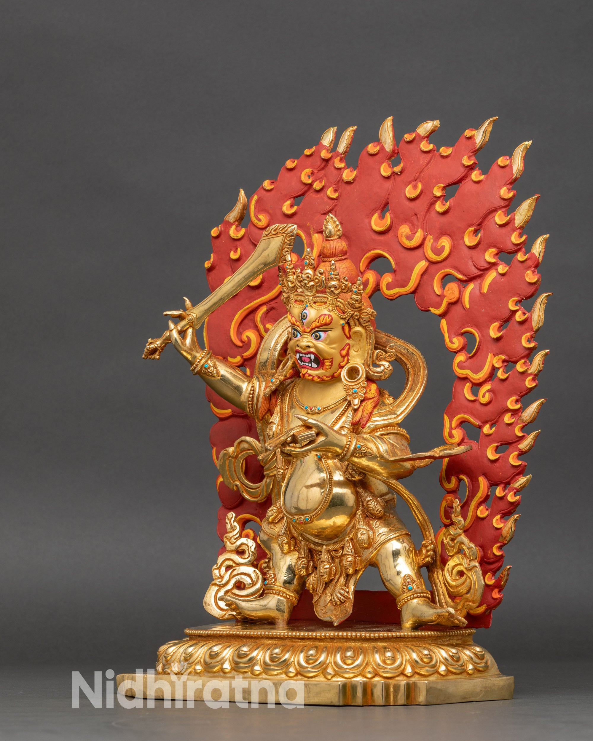 Left side view of Black Manjushri sculpture, wrathful Bodhisattva in gold-gilded copper