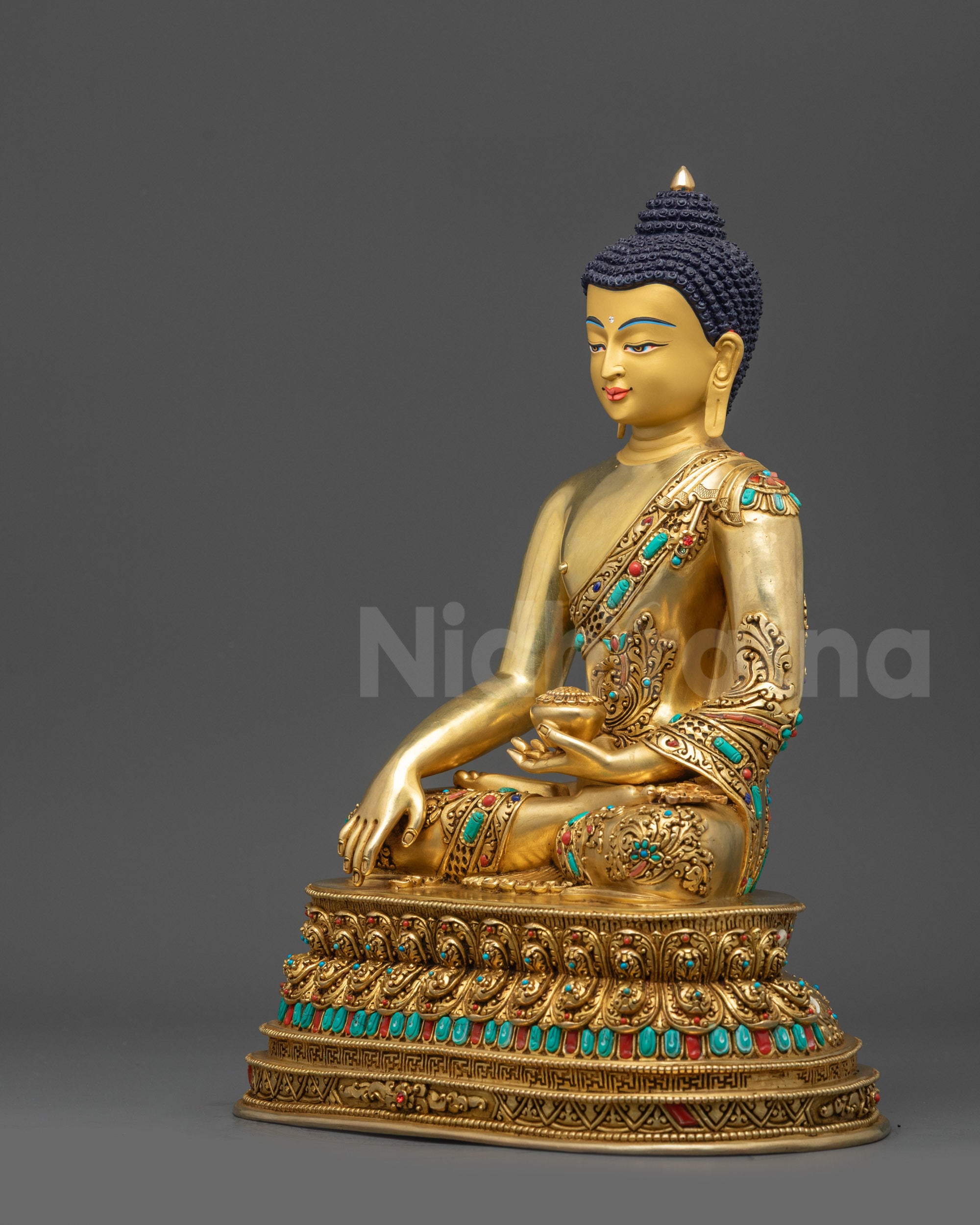 Left side view of Buddha Shakyamuni statue with protective Garuda head and stone embellishments