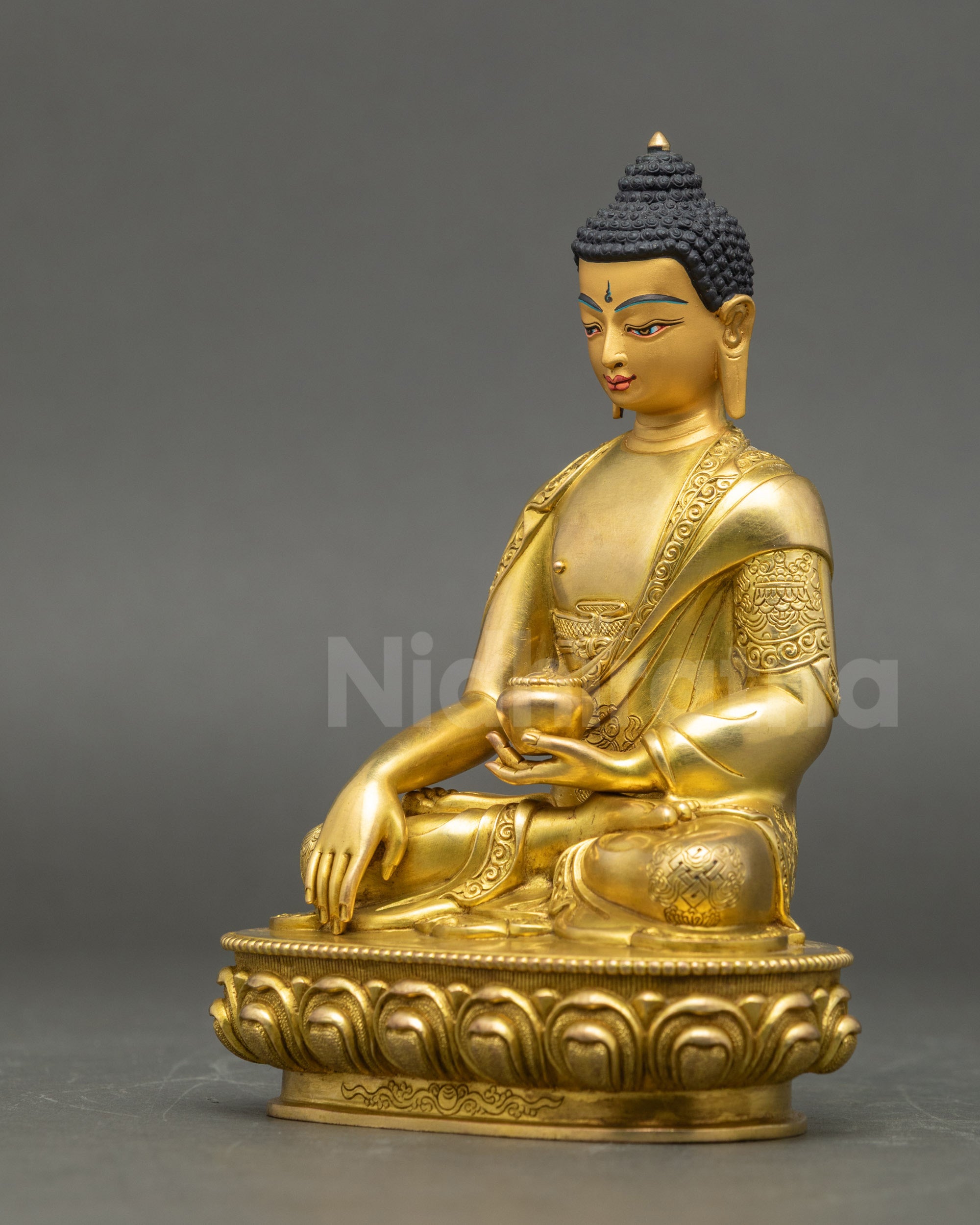 Left side view of Gautama Buddha Statue with intricate copper detailing