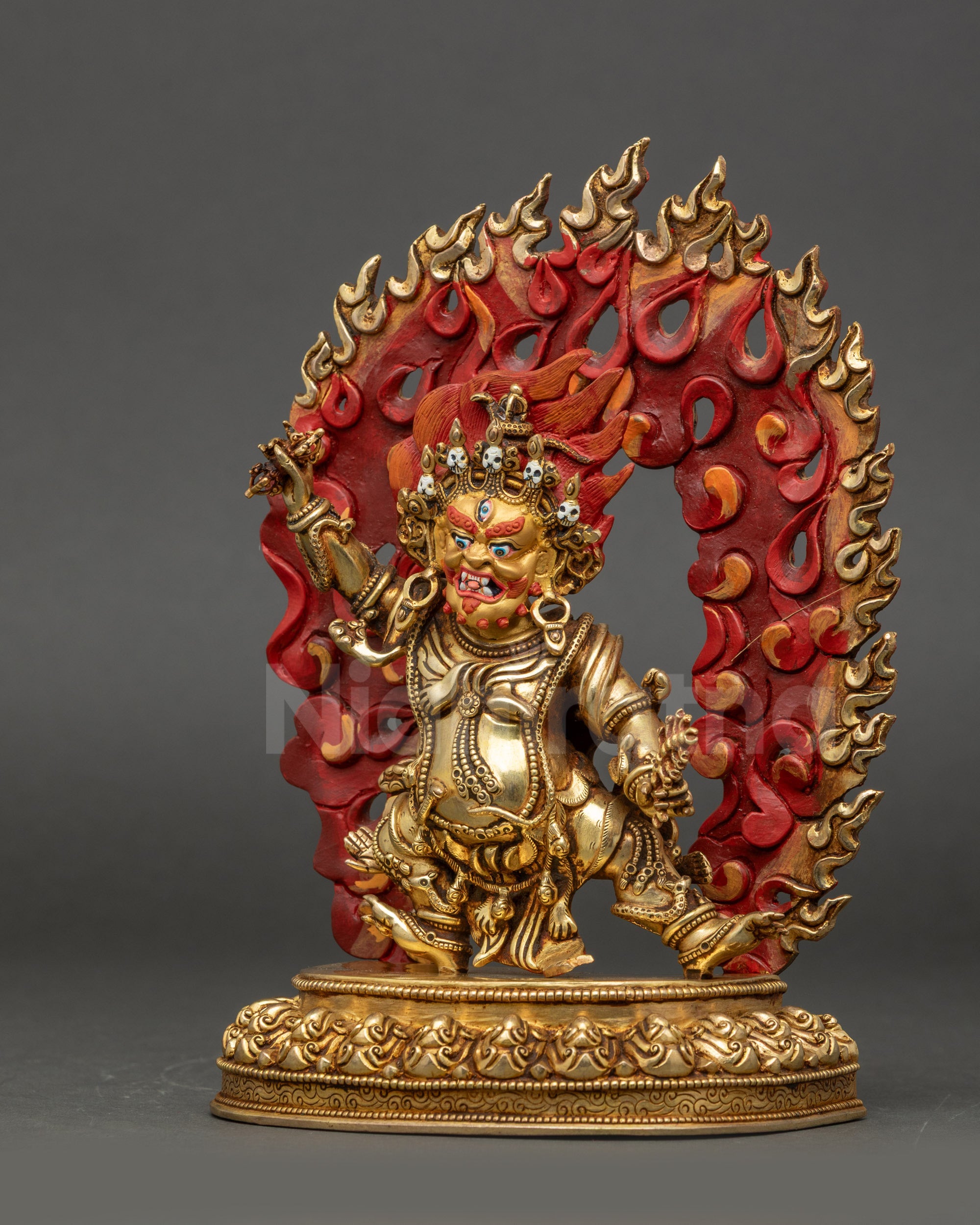 Left side view of Guru Dragpo Statue showing swirling robes and halo