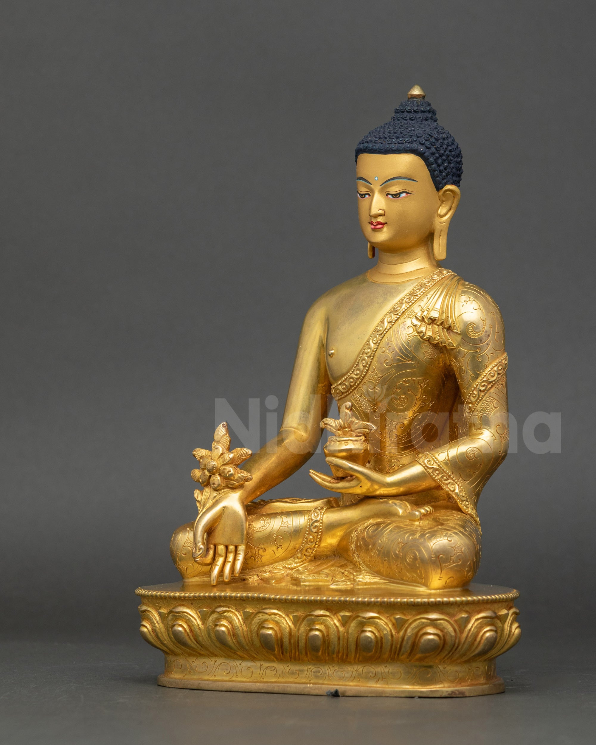 Left side view of Healing Buddha Bhaisajyaguru Statue highlighting gold gilded details