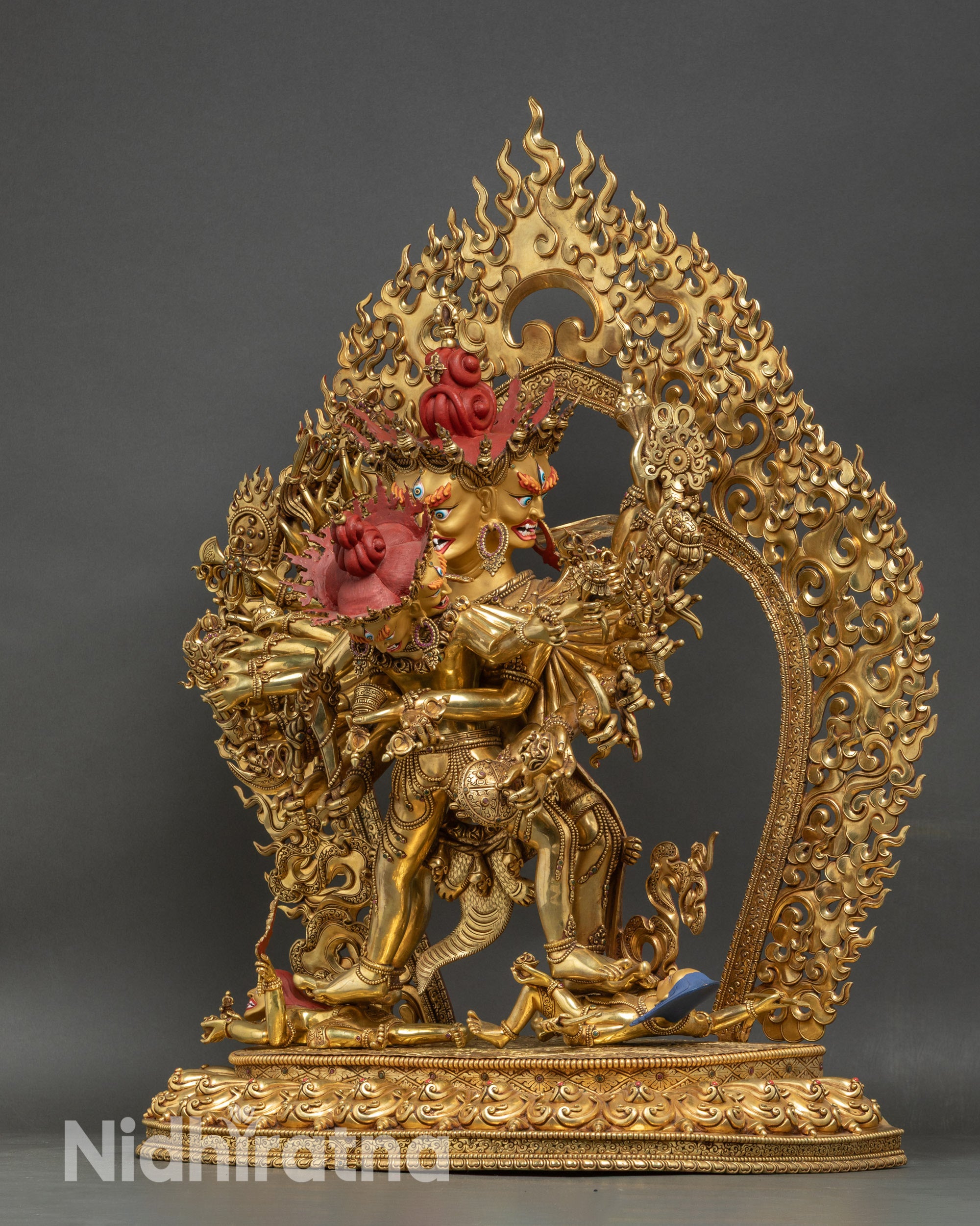 Left side view of Kalachakra Statue, detailed arms and ritual attributes visible