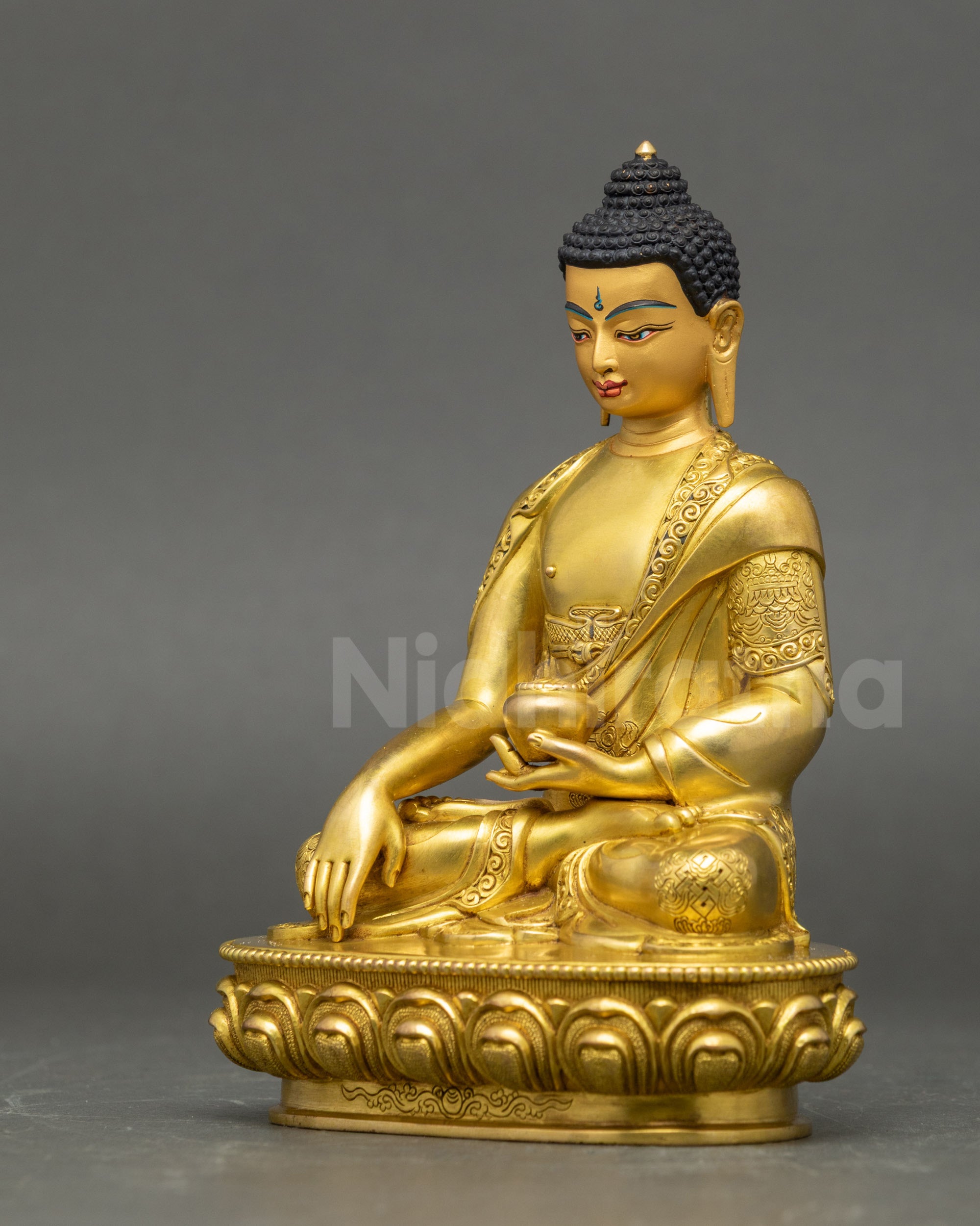 Left side view of Shakyamuni Buddha Statue showcasing gold-gilded copper artistry