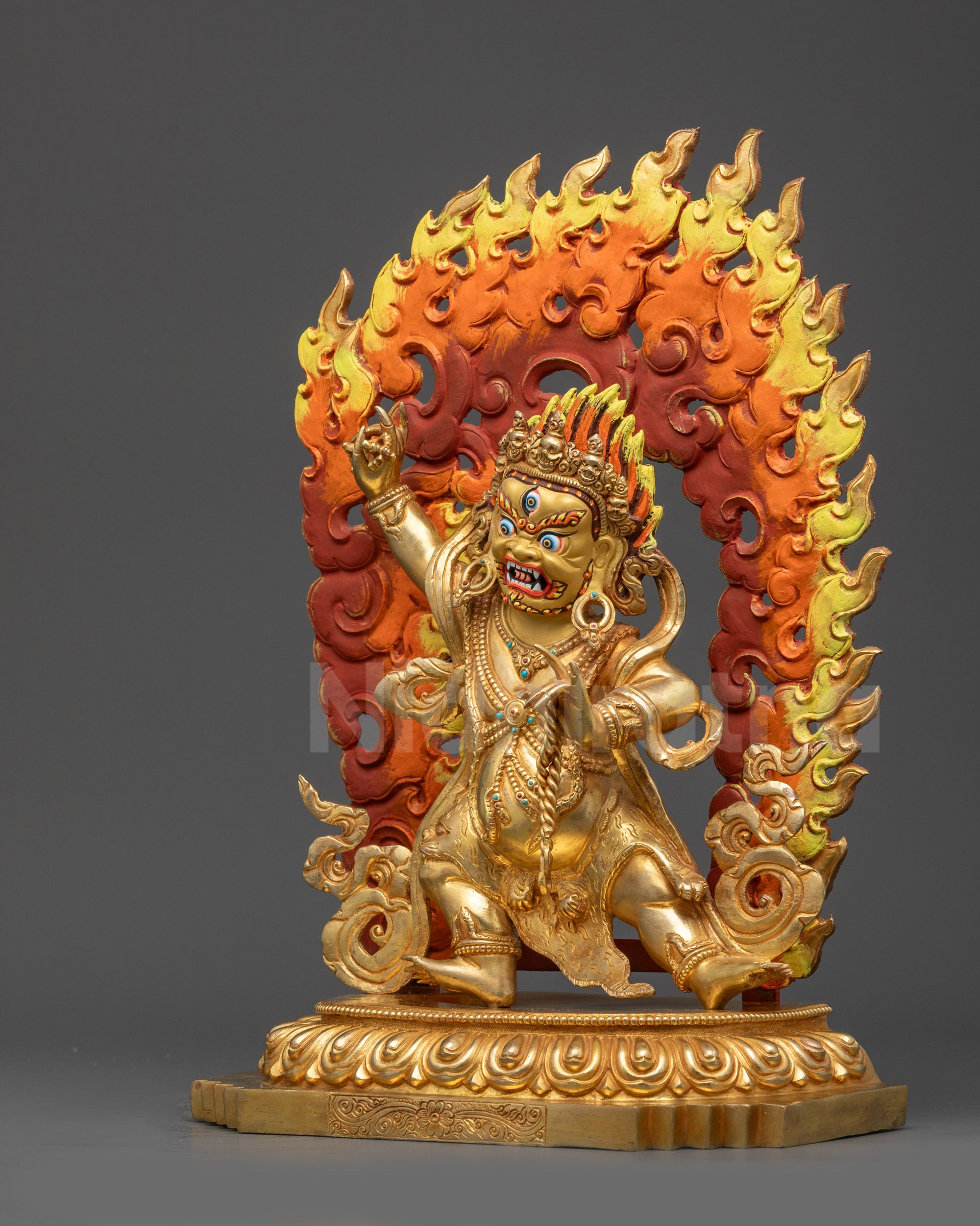 Left side view of Vajrapani Statue with detailed patterns on garments