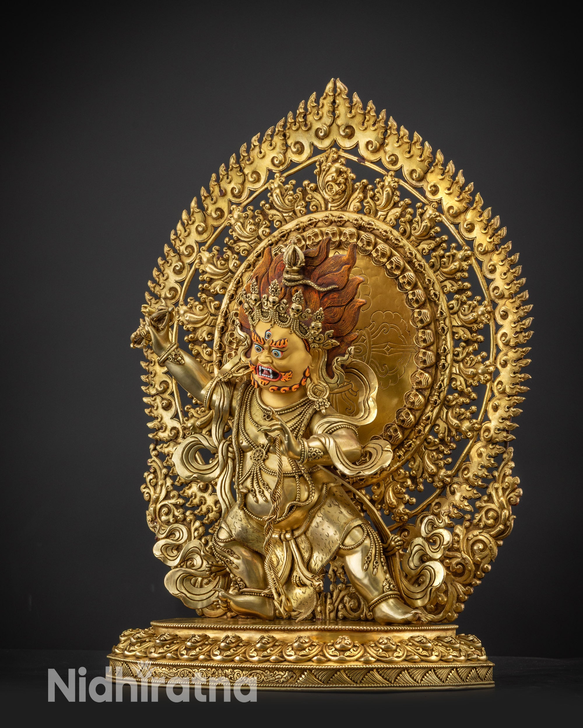 Left side view of Vajrapani statue displaying halo and ornaments