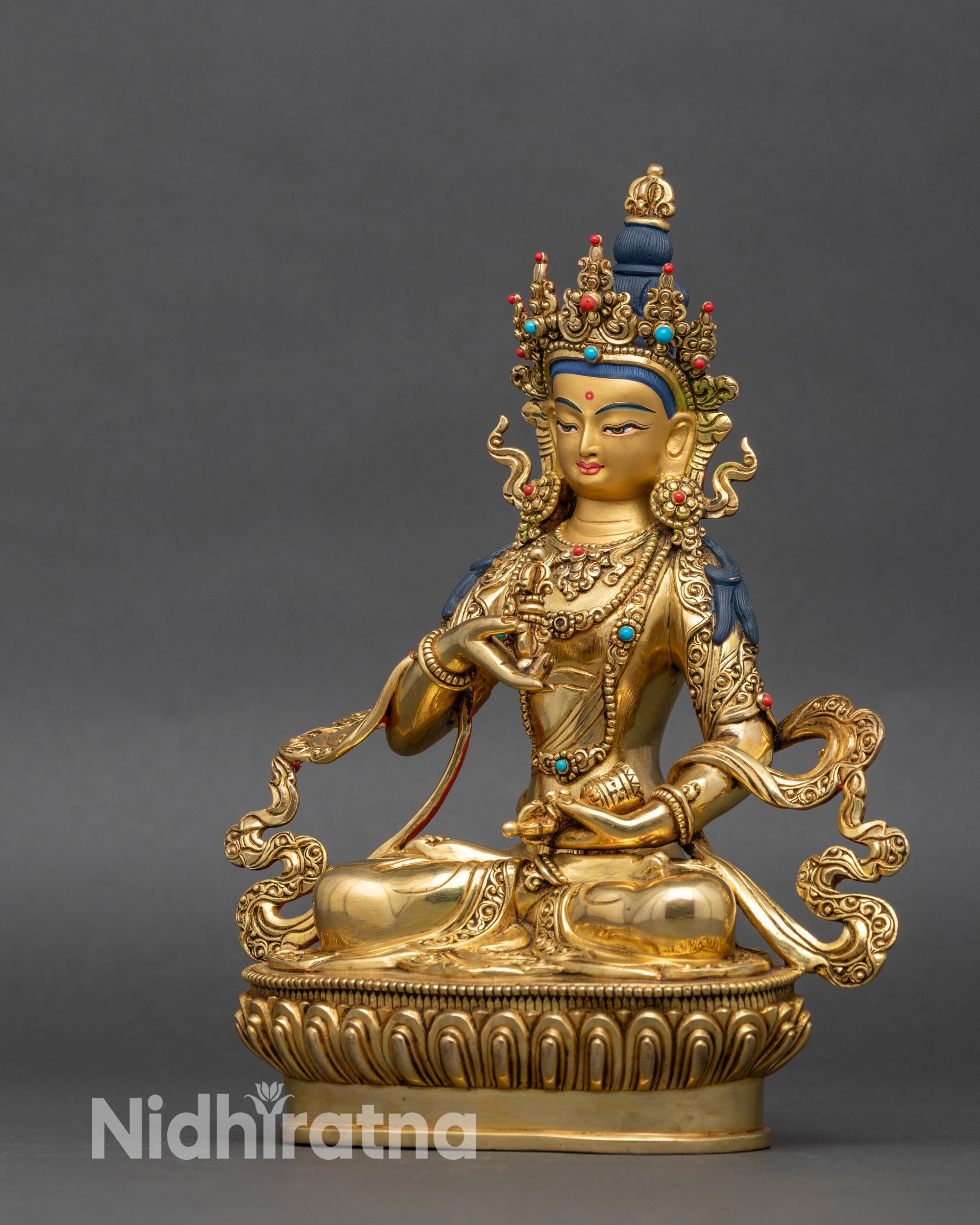 Left side view of Vajrasattva Bodhisattva statue seated in meditative posture
