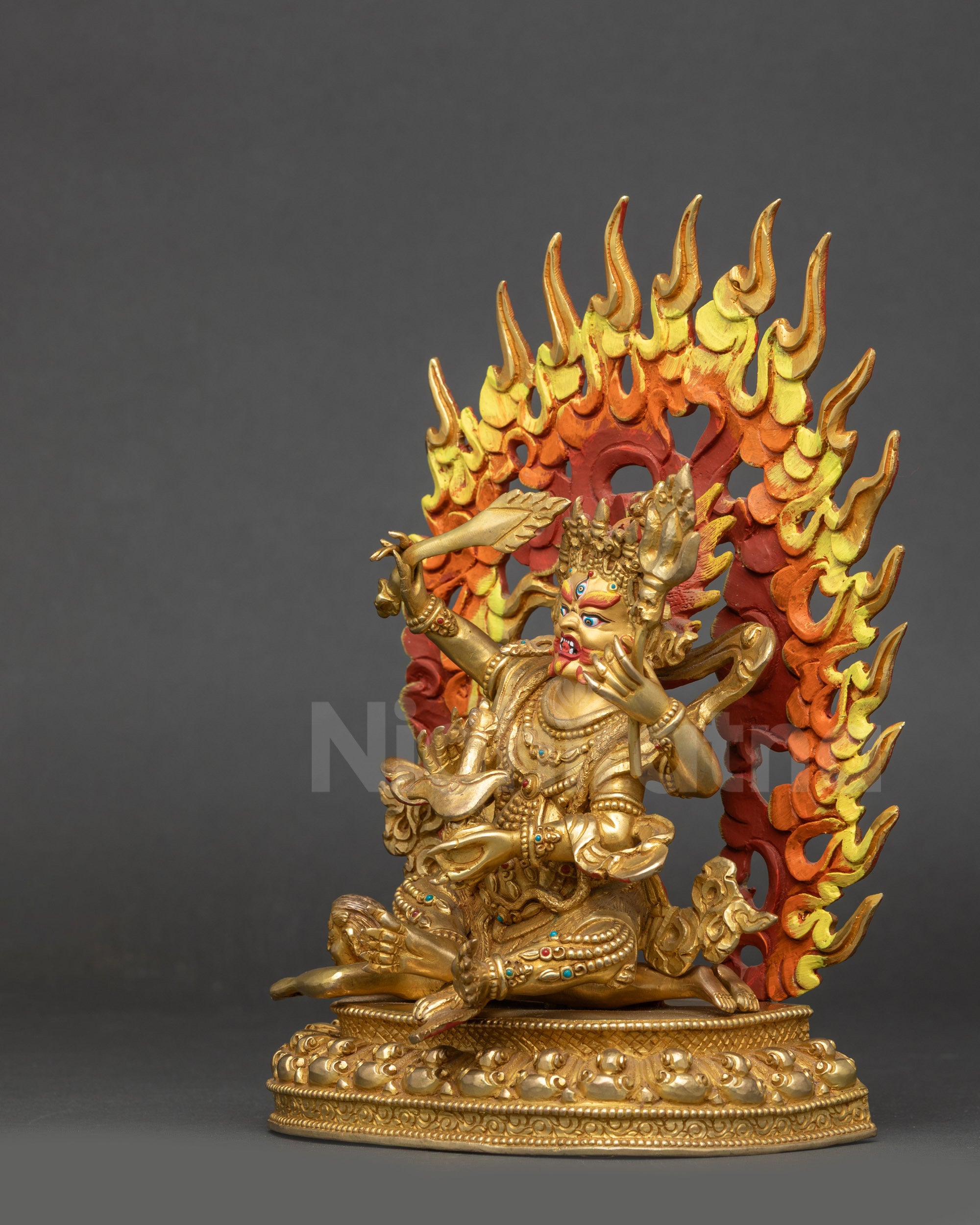 Left view side Four-Armed Mahakala statue wisdom flame halo and ritual implements