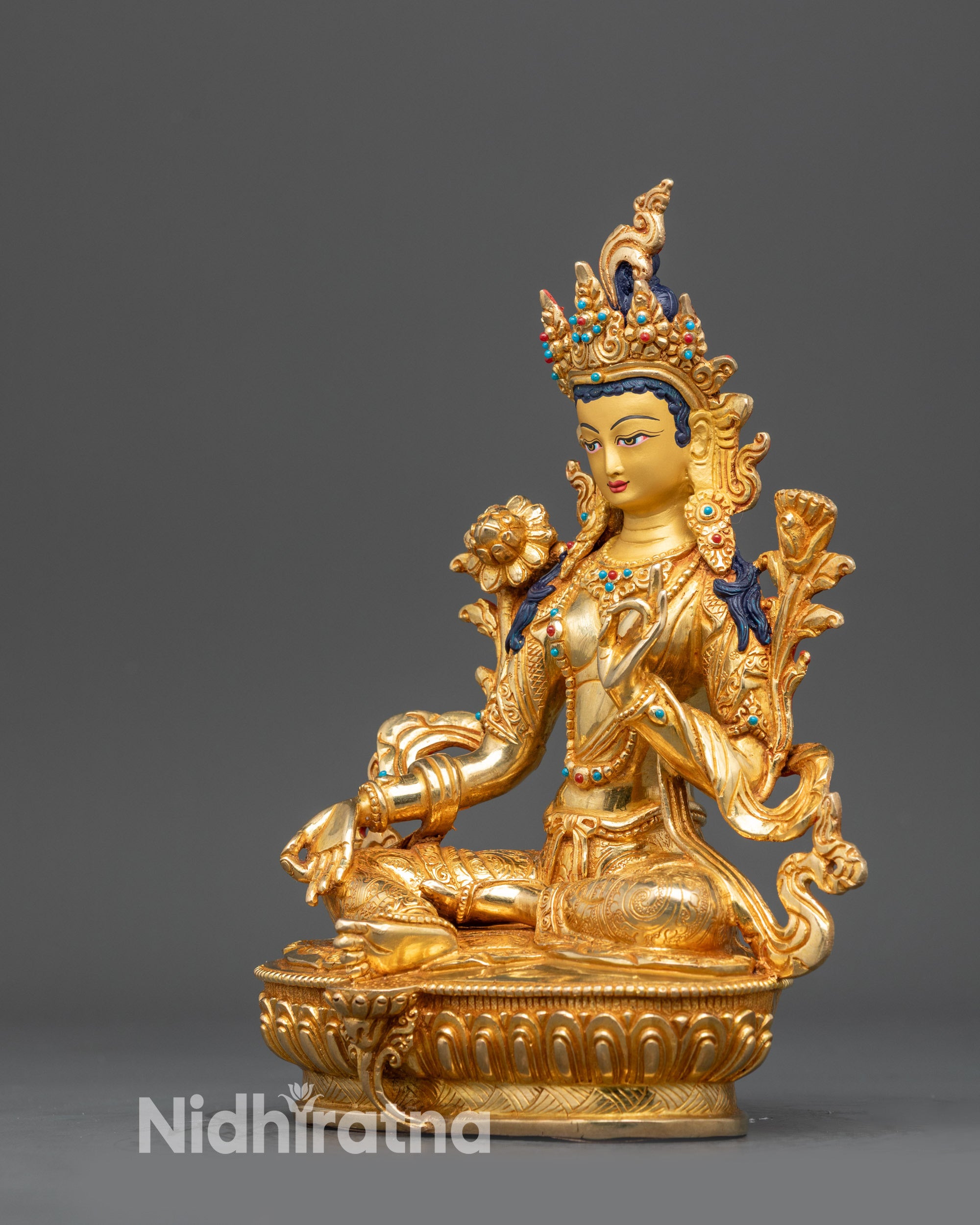 Left view side Green Tara Tibetan sculpture with flowing robes and ornaments