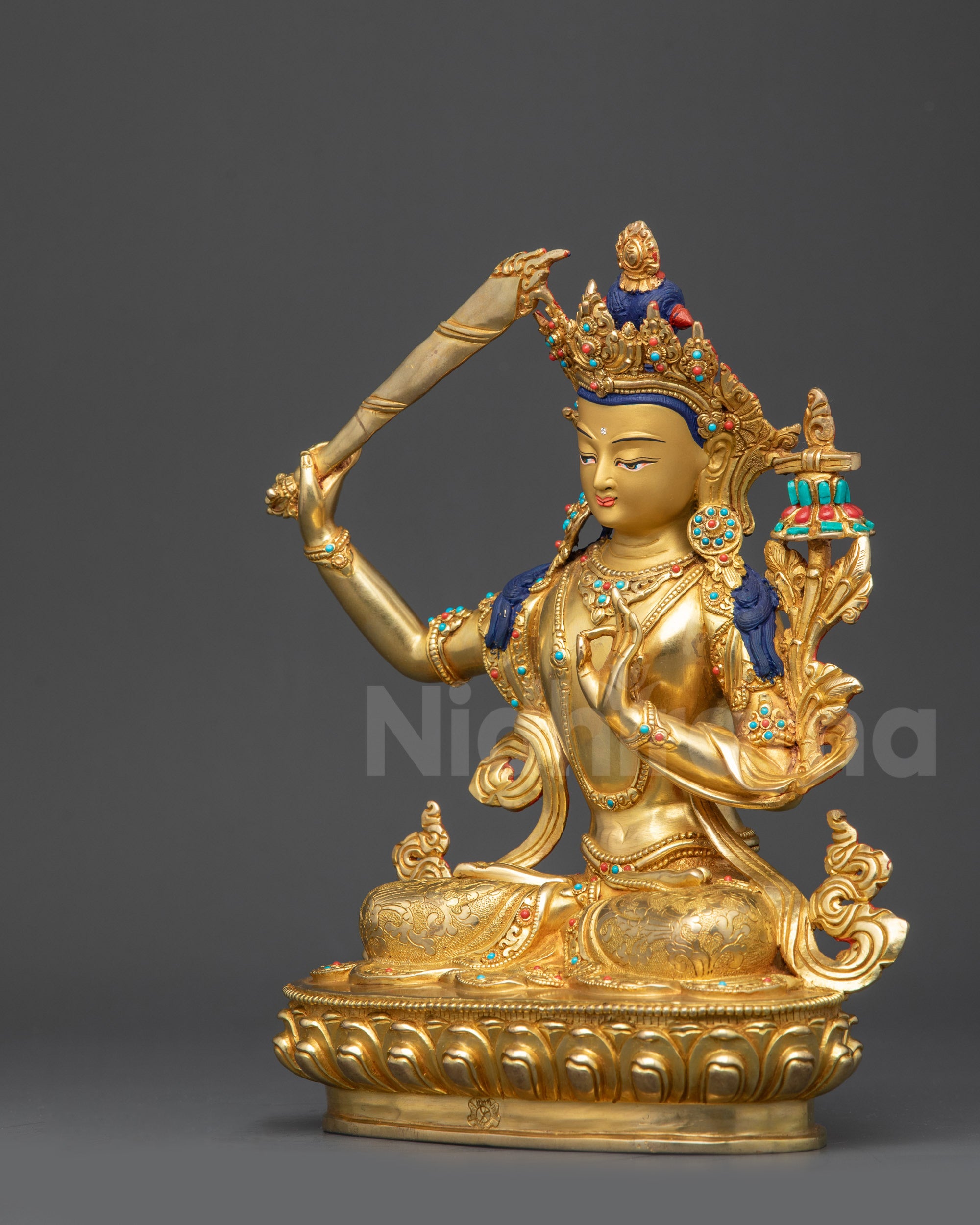 Left view side Manjushri Sculpture showing swirling robes and divine meditation posture