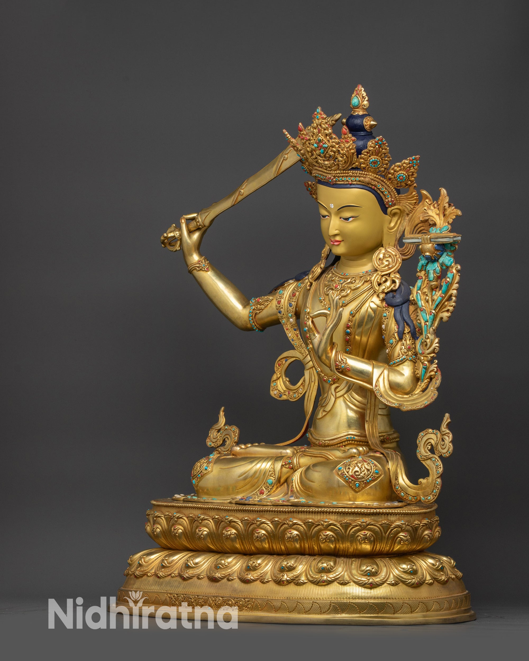 Left view side Manjushri Sculpture with five-jeweled crown and meditative pose