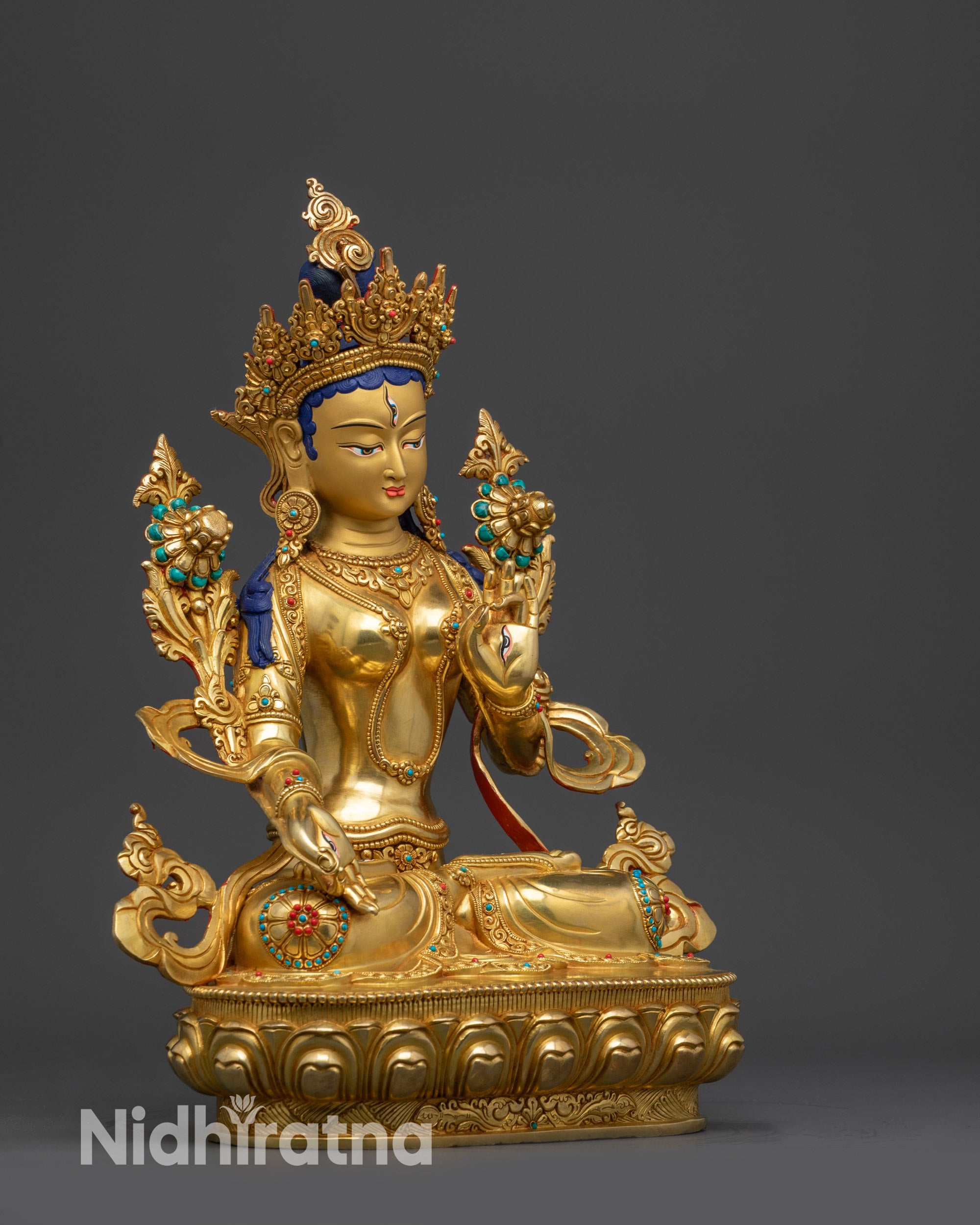 Left view side White Tara holding utpala stem in Varada and Vitarka mudra with detailed carving