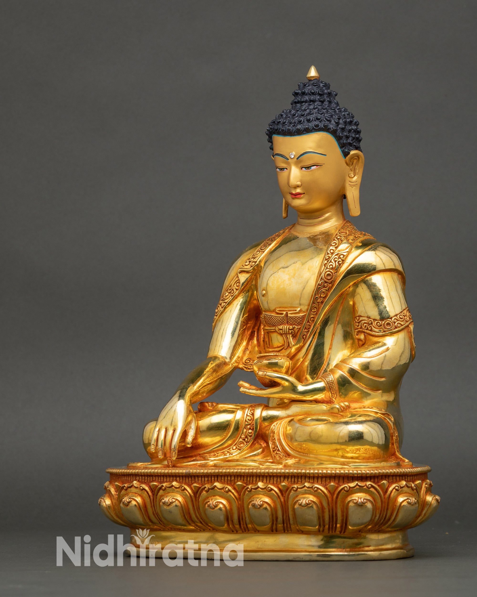 Left view side of Buddha Shakyamuni Statue, hand-carved copper with gold accents