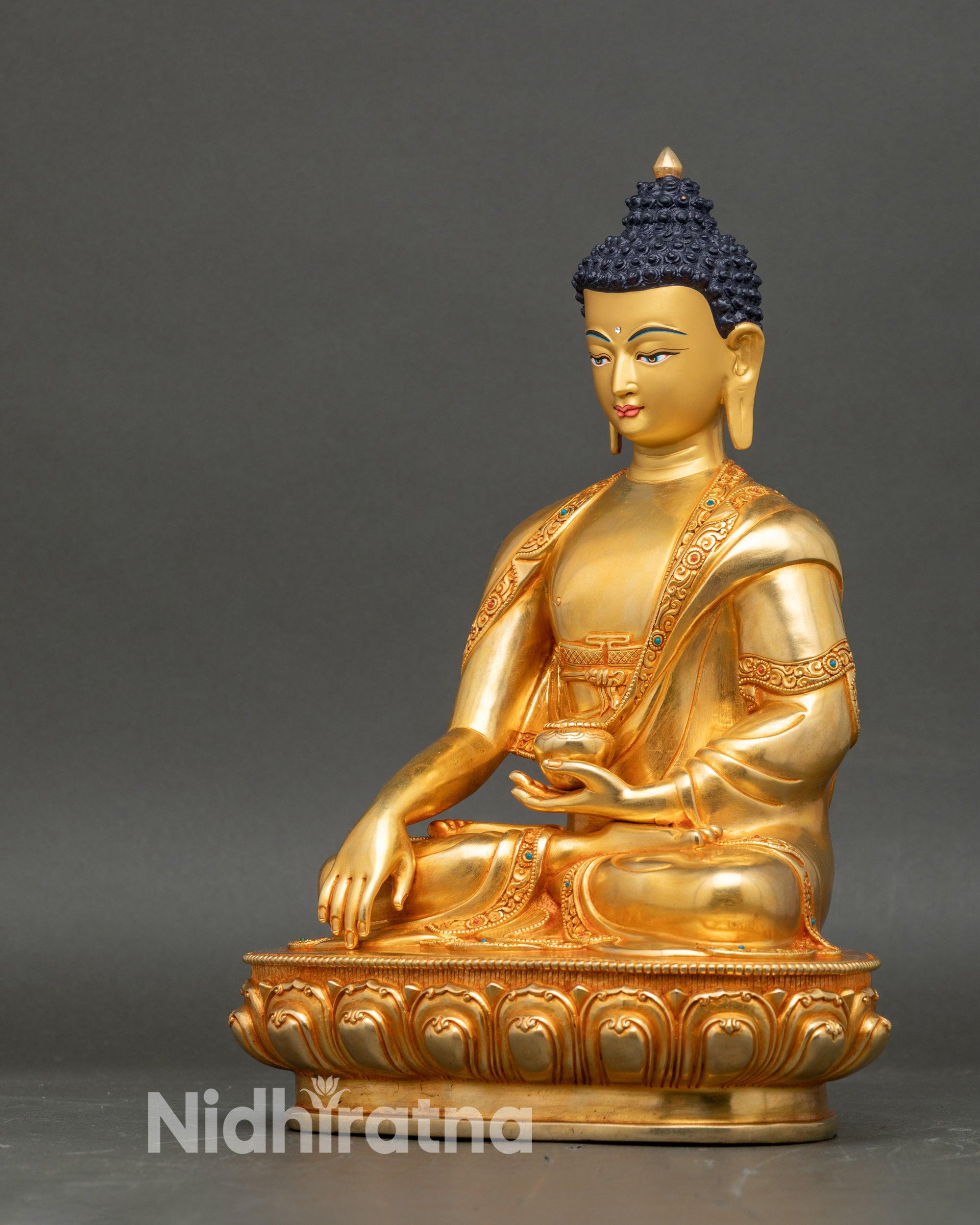 Left view side of Buddha sculpture showing detailed robe and meditation posture