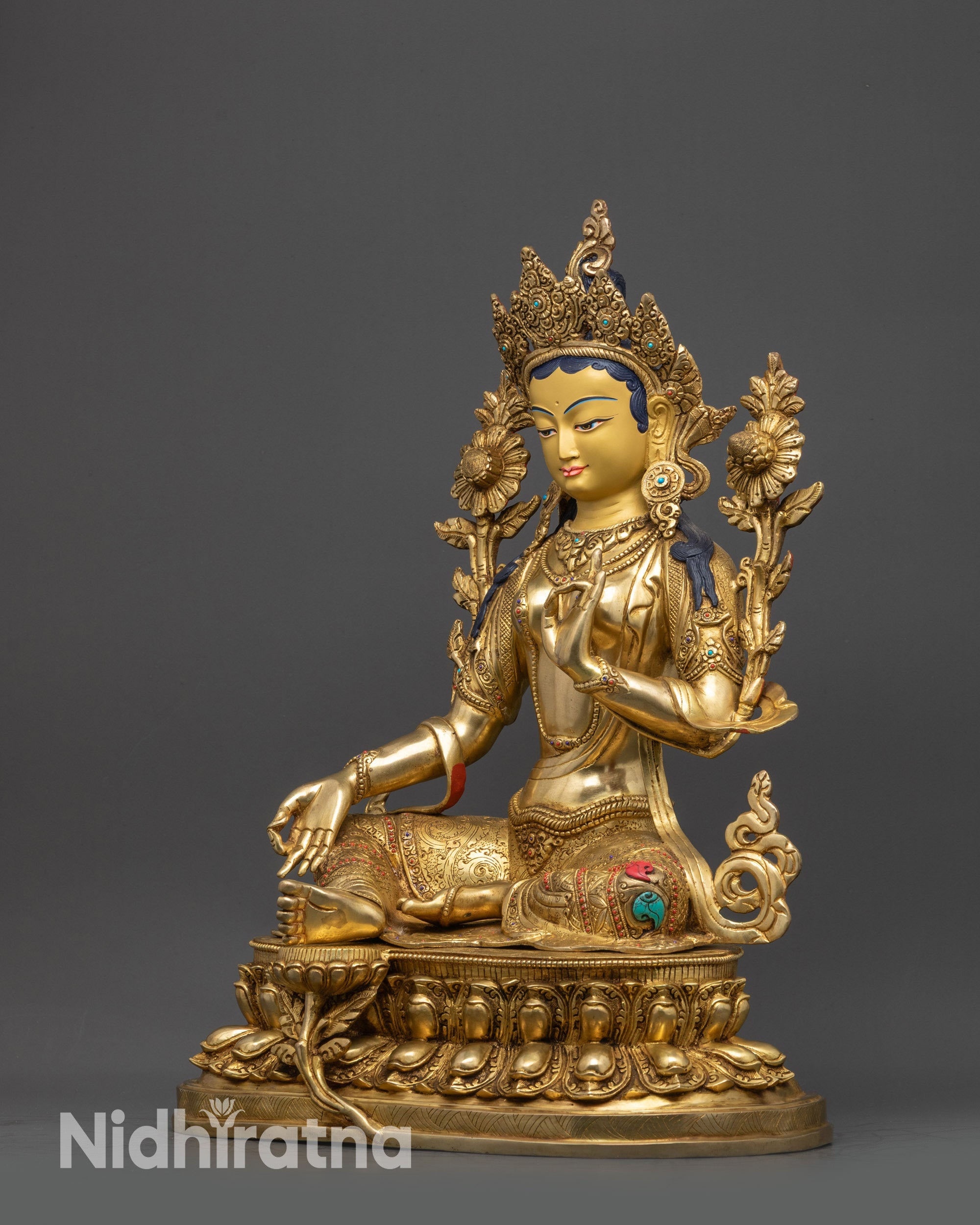 Left view side of Green Tara Statue showing flowing robe and intricate jewelry