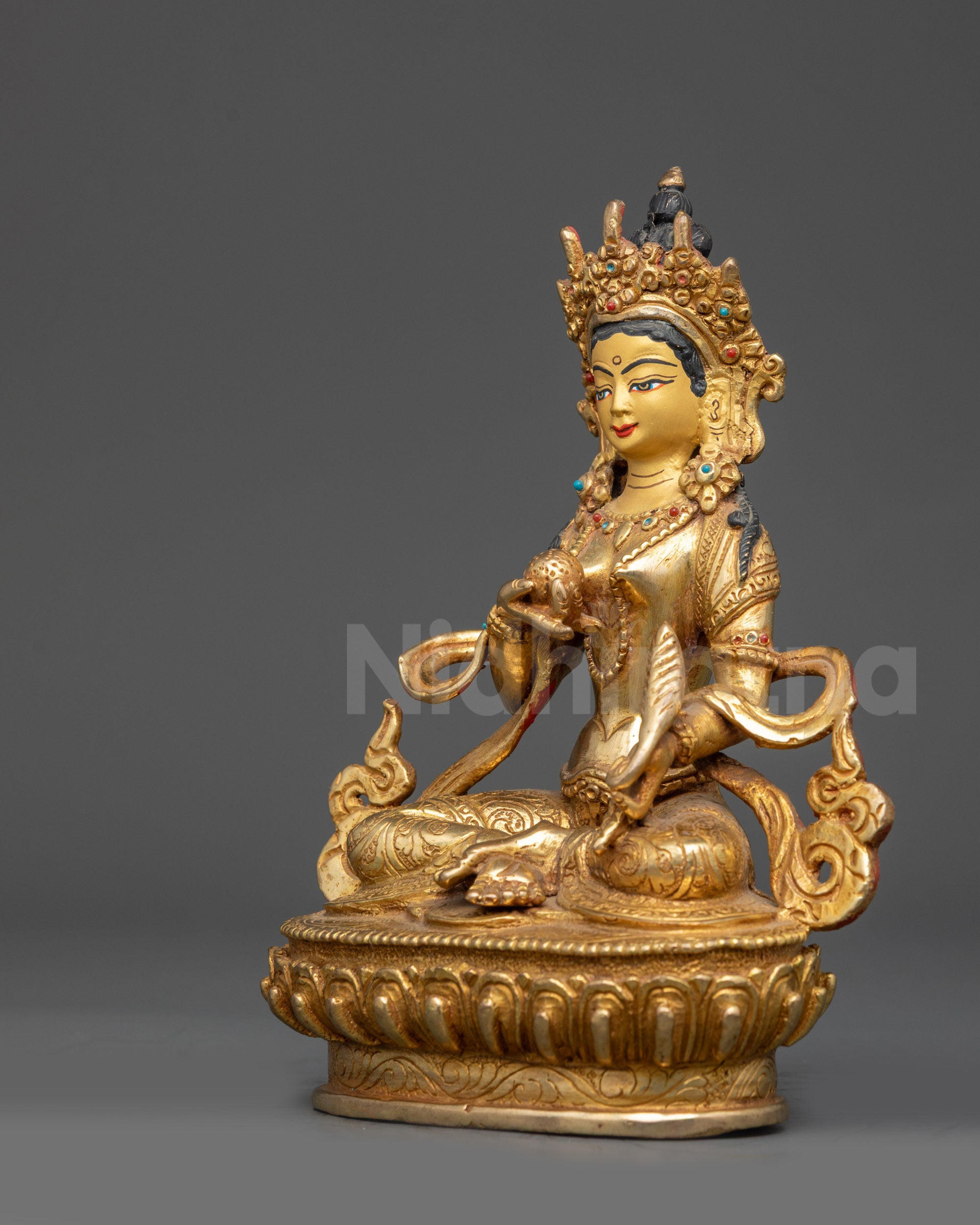 Left view side of Kshitigarbha Bodhisattva statue highlighting crown and jewelry