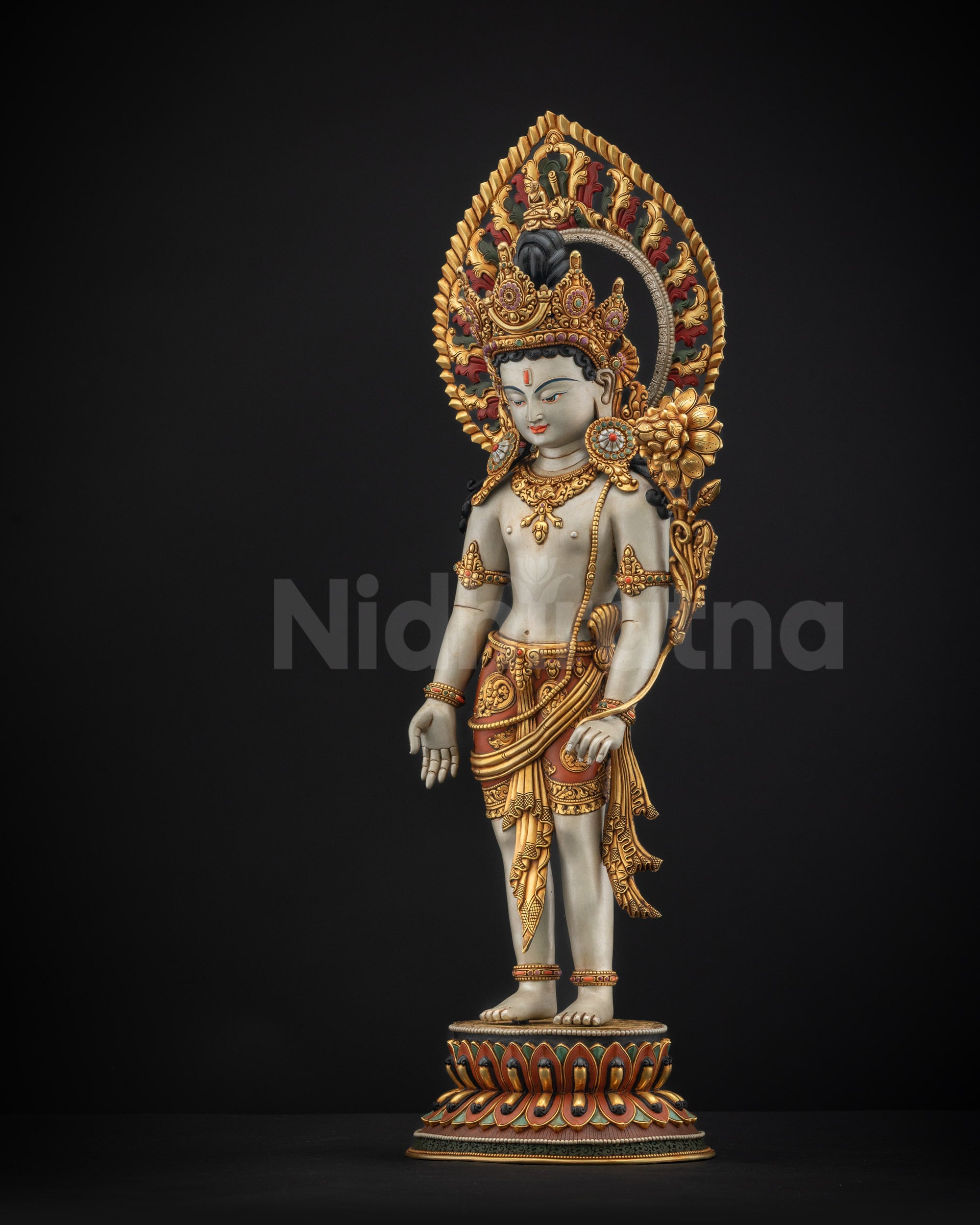Left view side of Lokeshvara statue showing detailed gold-gilded armlets and garments