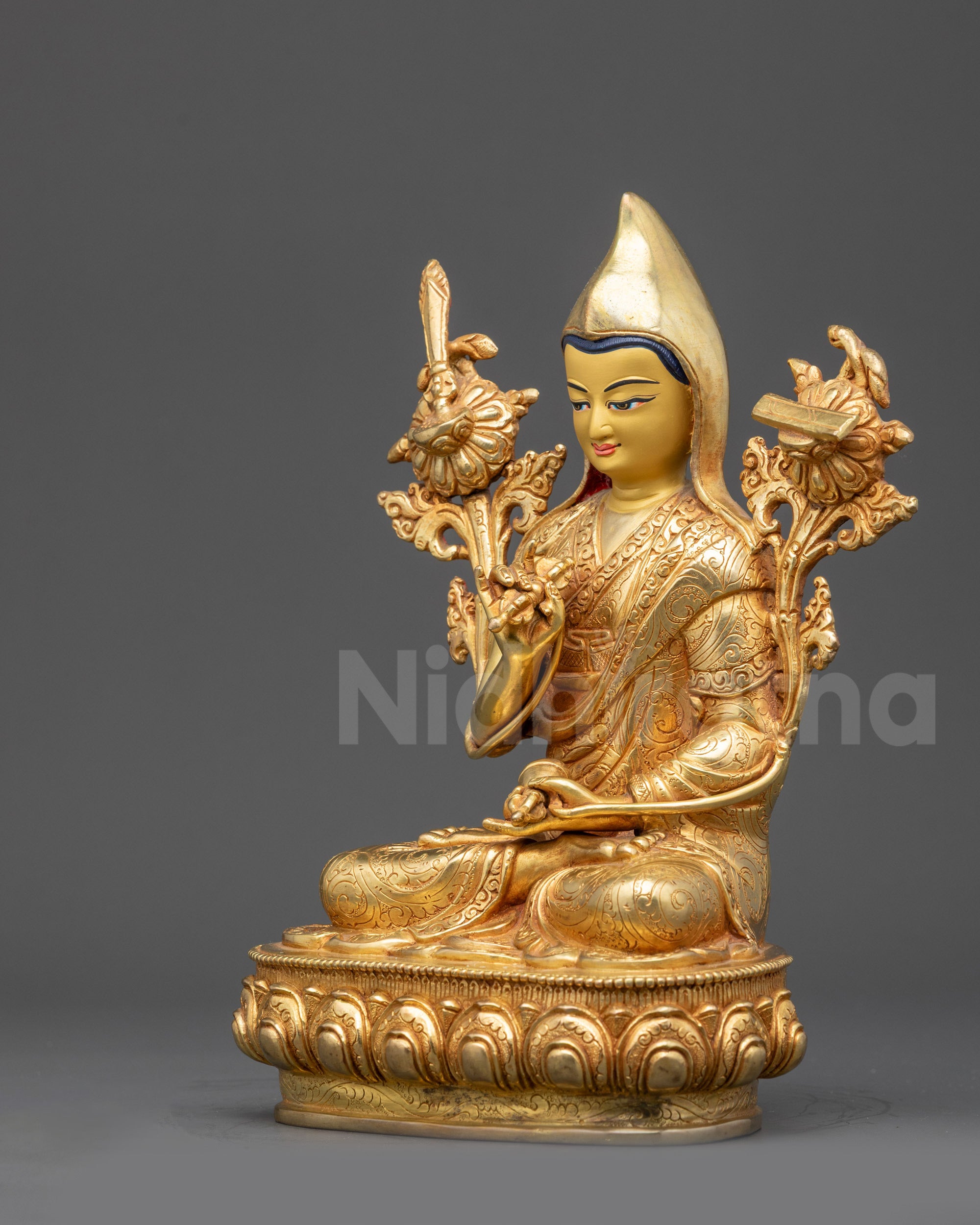 Left view side of Longchenpa statue with flower motif, wisdom sword, and robe patterns