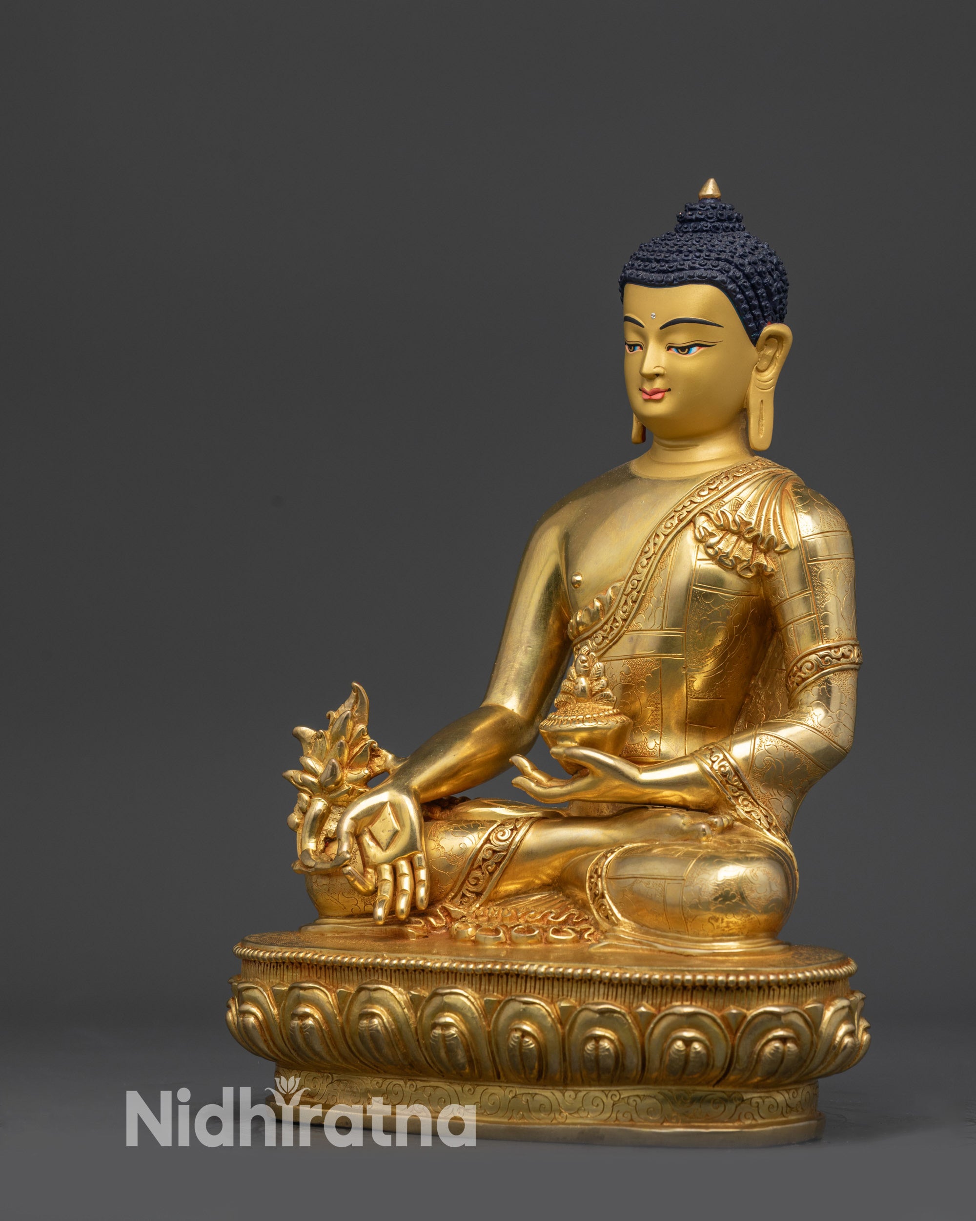 Left view side of Medicine Buddha statue in copper alloy with gold gilding