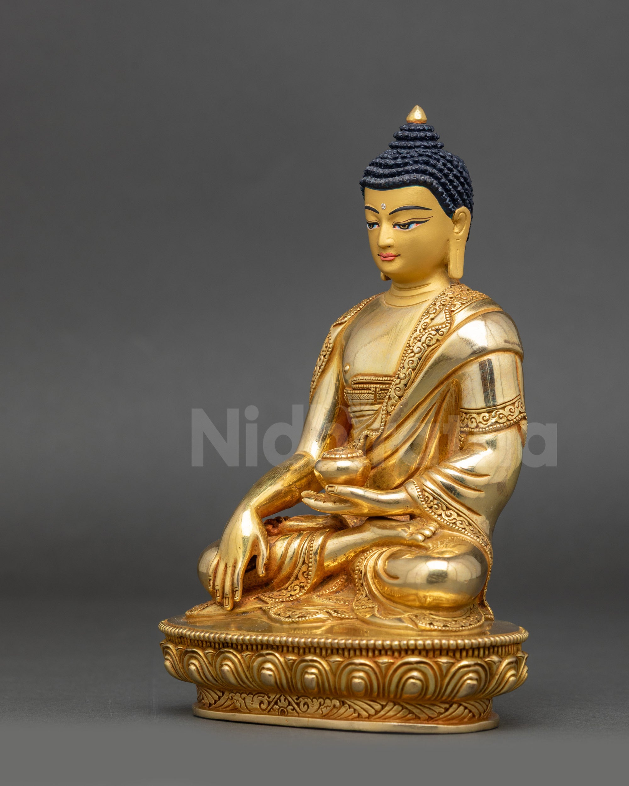 Left view side of Shakyamuni Buddha Figure showing Bhumisparsha mudra and gold finish
