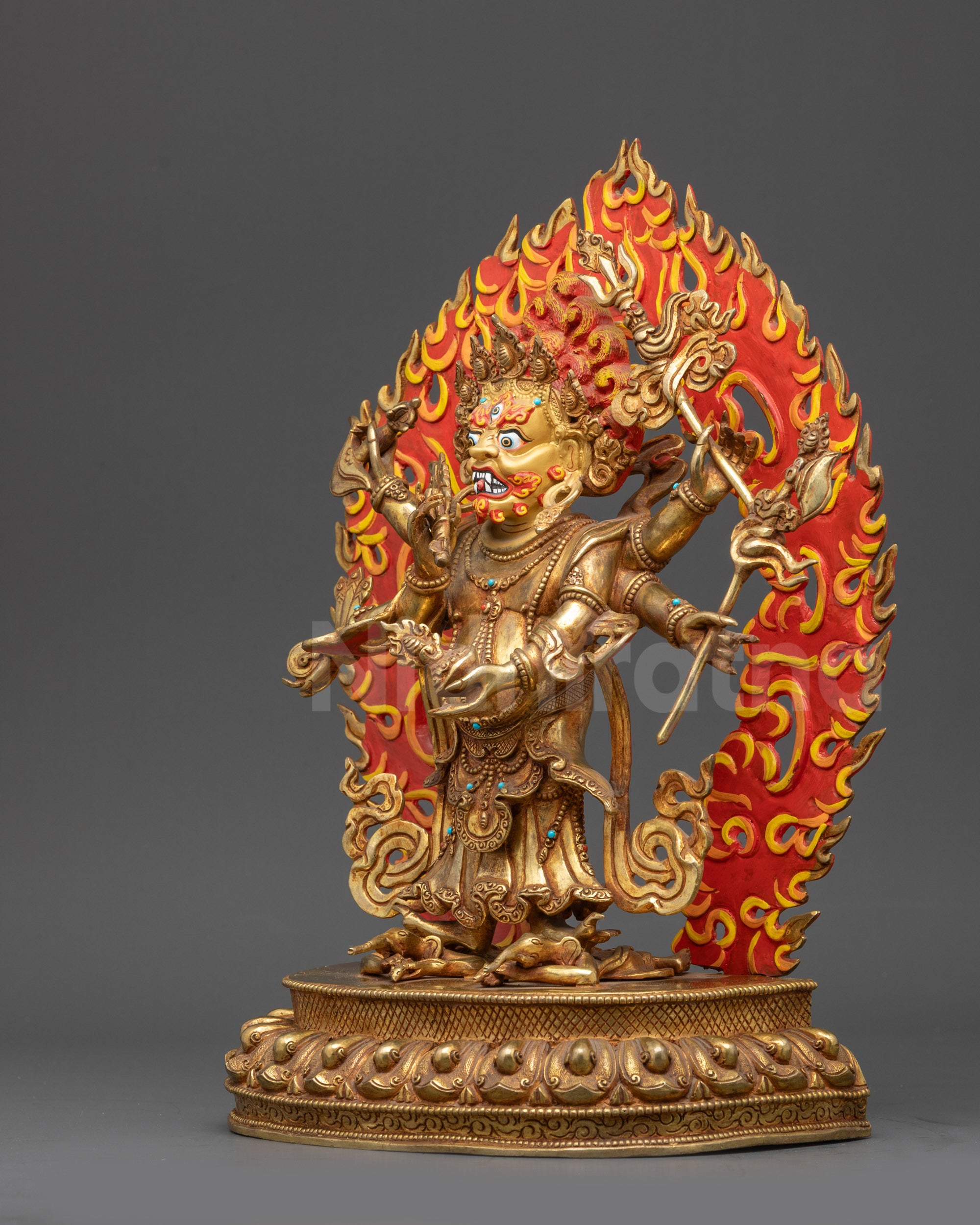 Left view side of White Mahakala statue showing crown, halo, and intricate ornaments