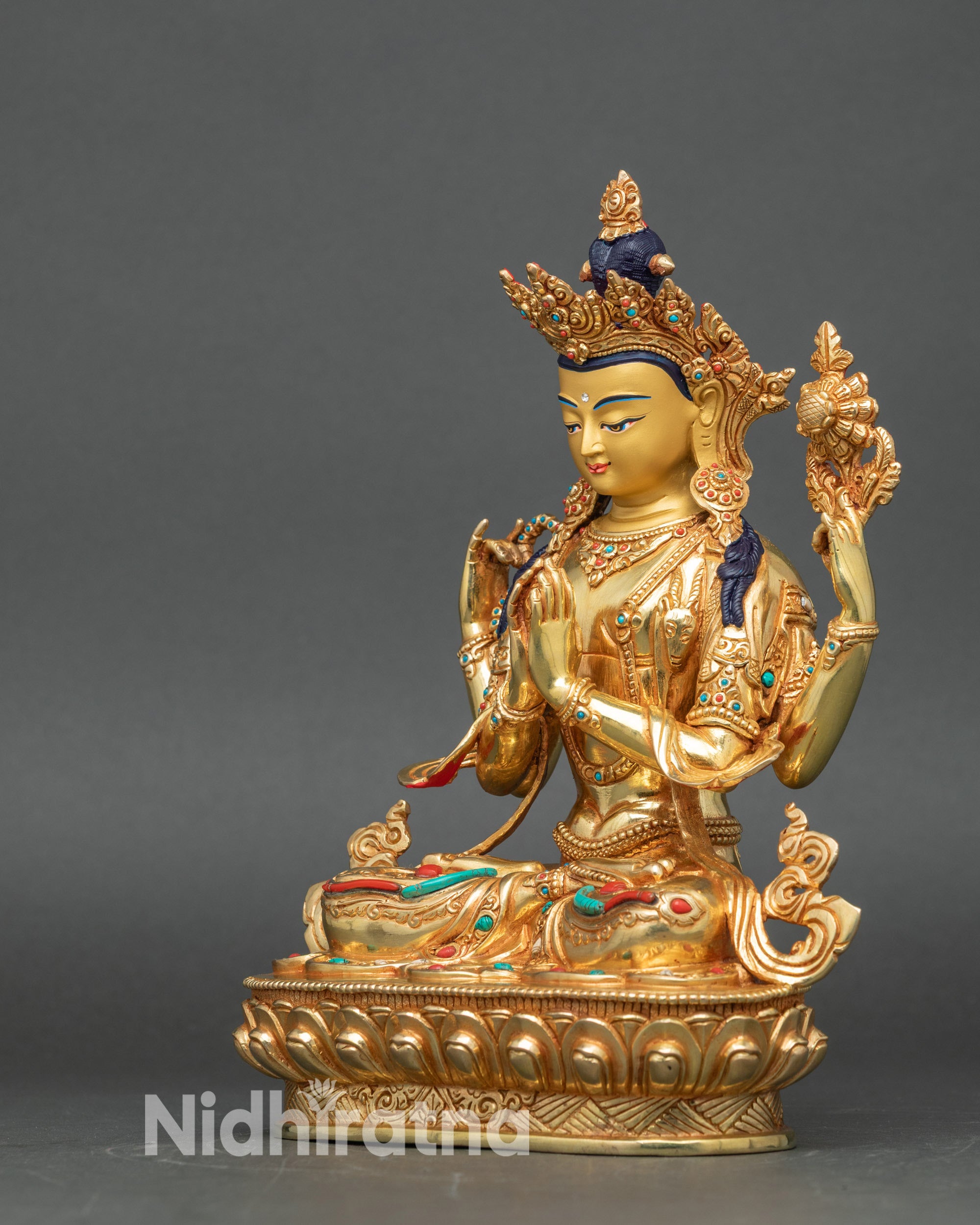 Left view with lotus and scripture, intricate patterned garments