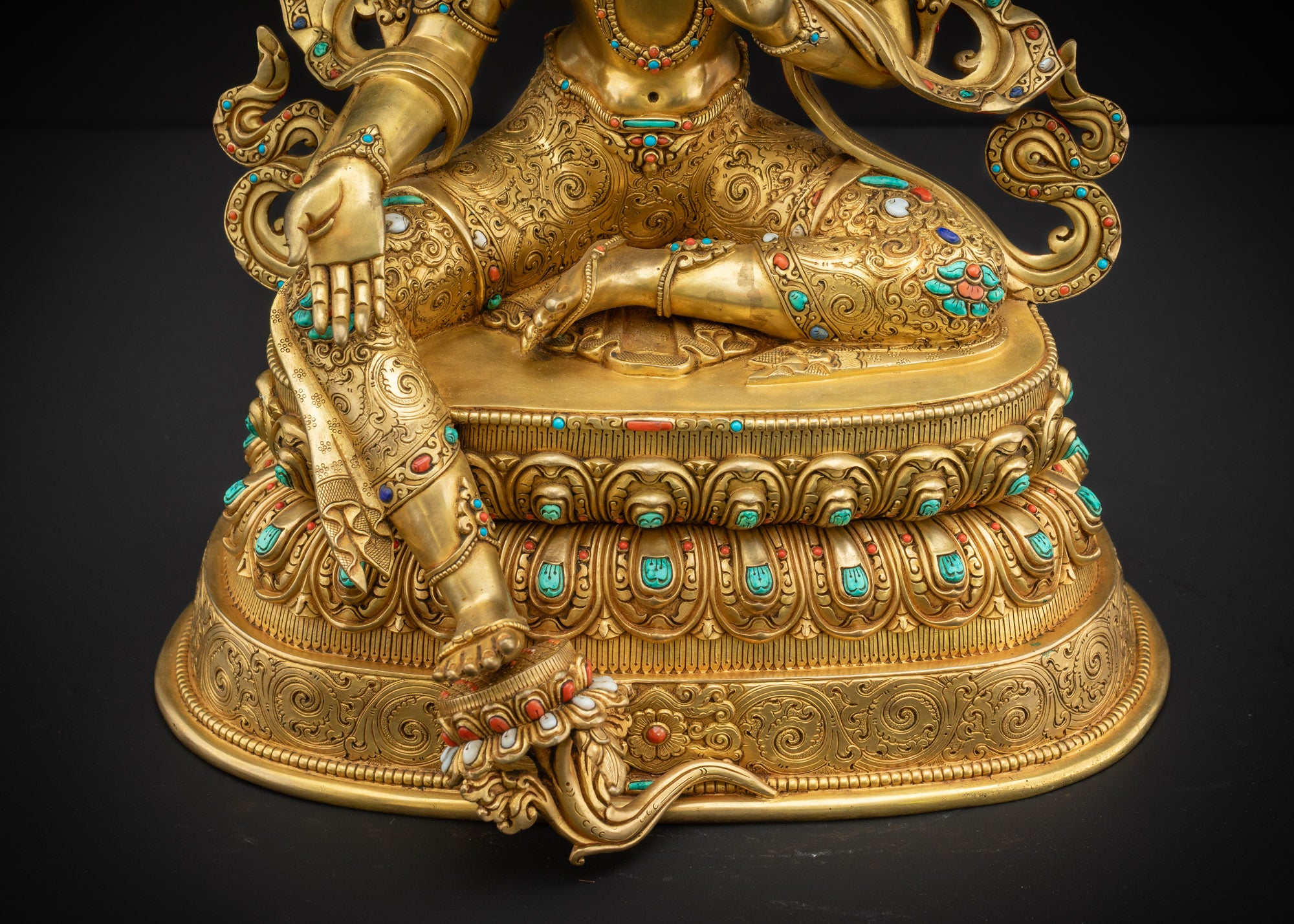 Lower front view Green Tara Statue showing lotus pedestal and flowing robes