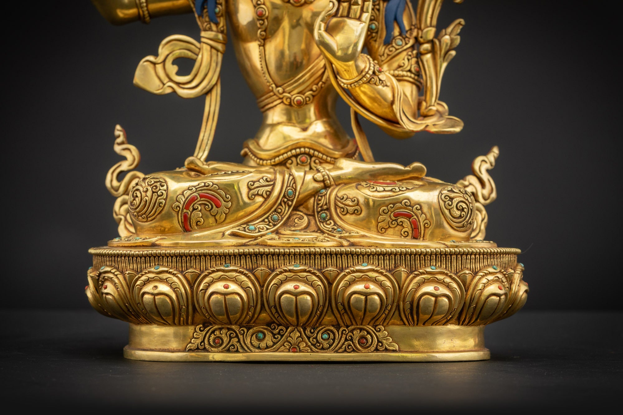 Lower landscape front of Manjushri Statue highlighting floral motifs on garments