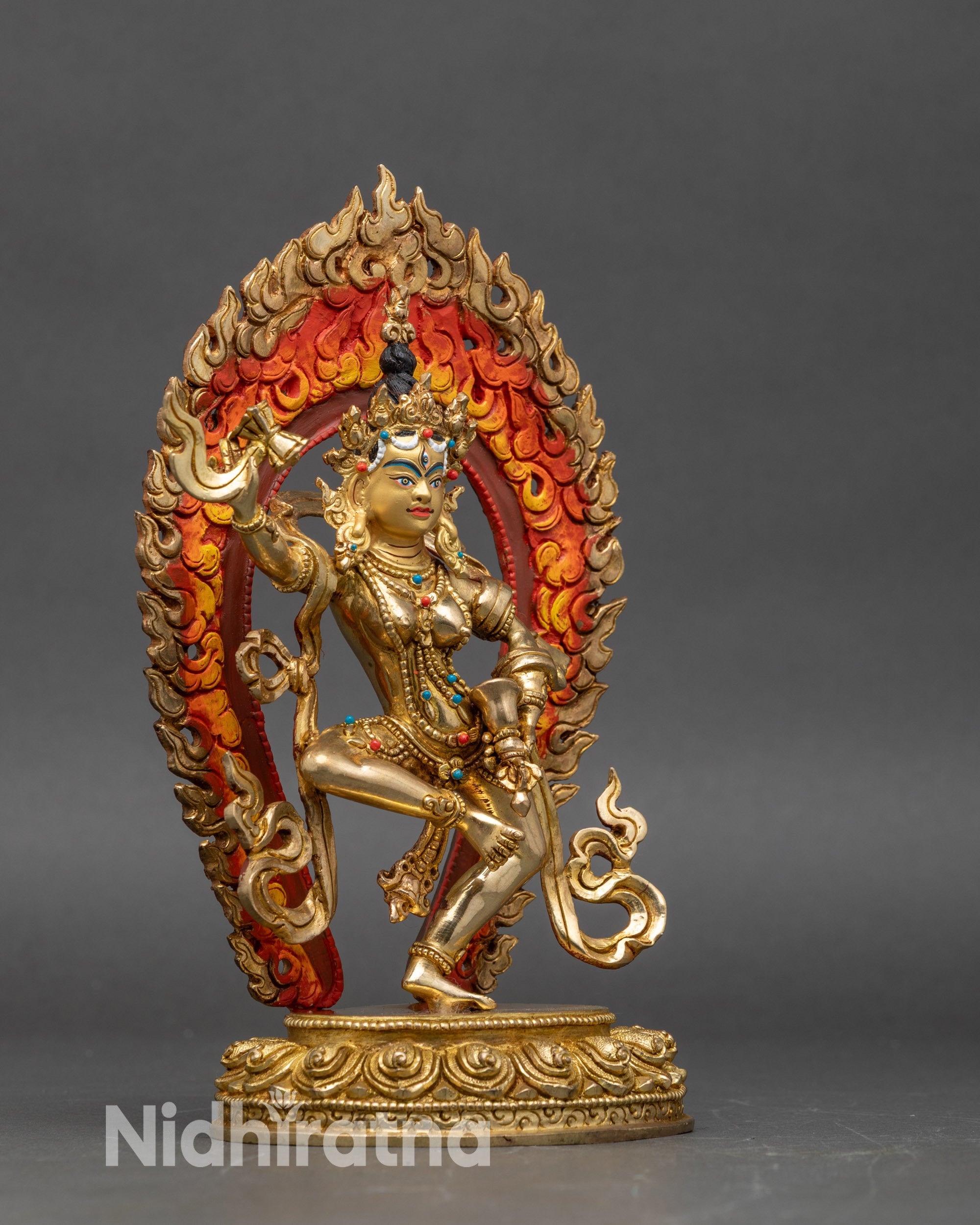 Machig Labdron standing on lotus seat holding damaru and ritual bell