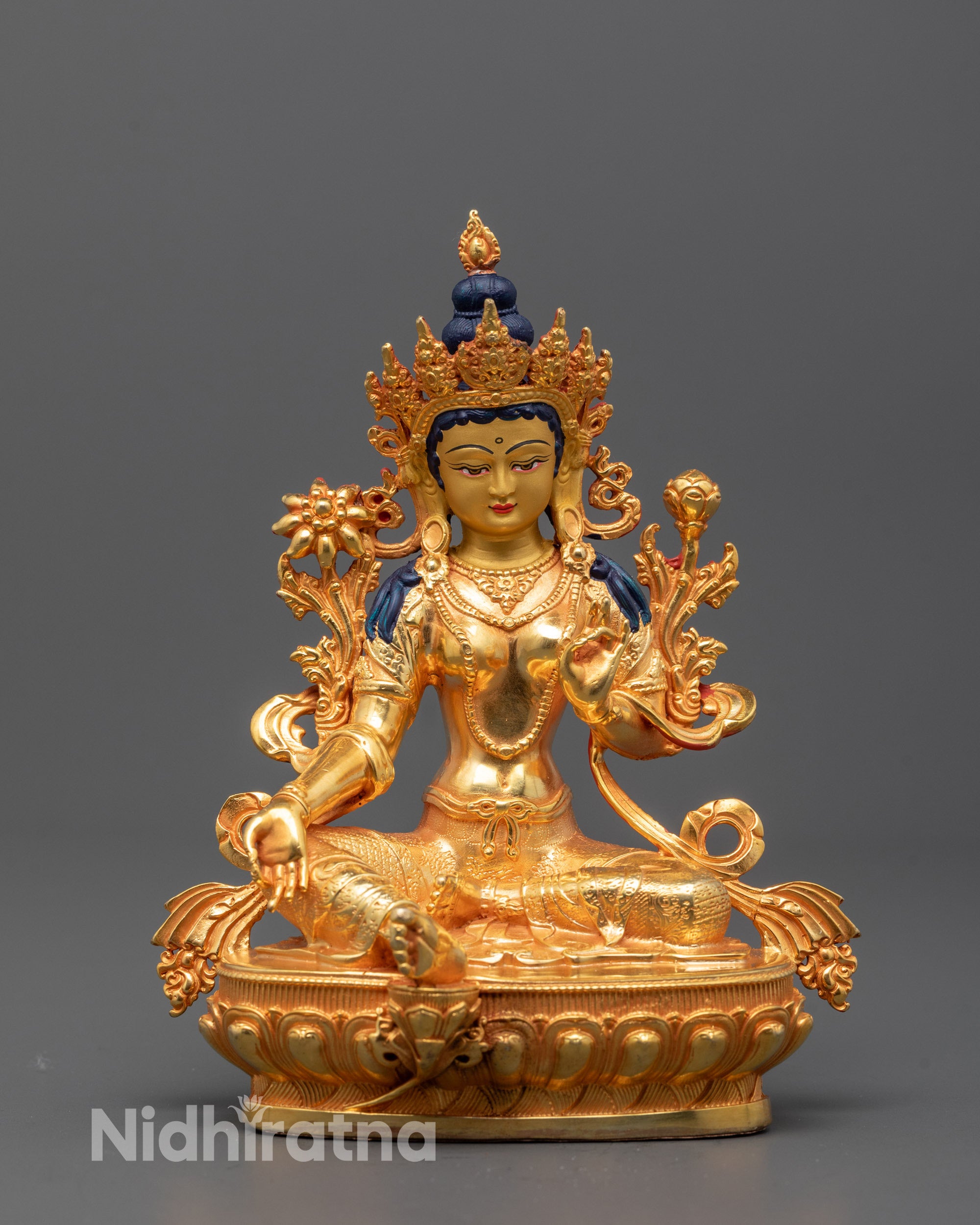 Machine-made Green Tara Statue seated on lotus with varada mudra hand gesture