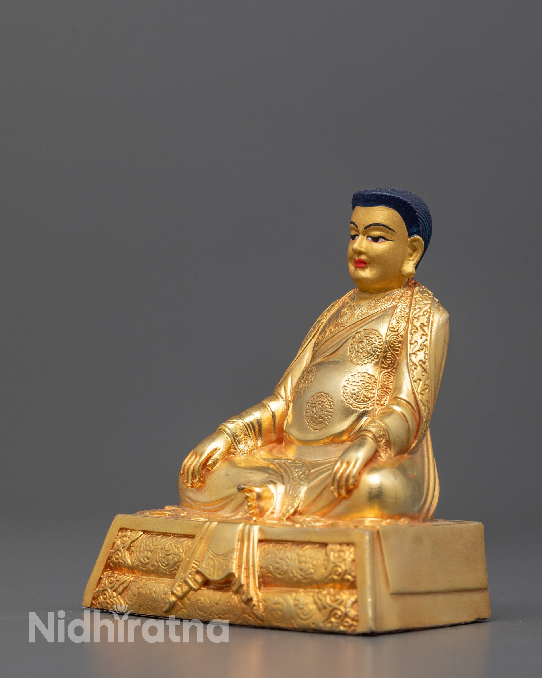 Machine-made Nepalese Marpha guru sculpture seated on a lotus base
