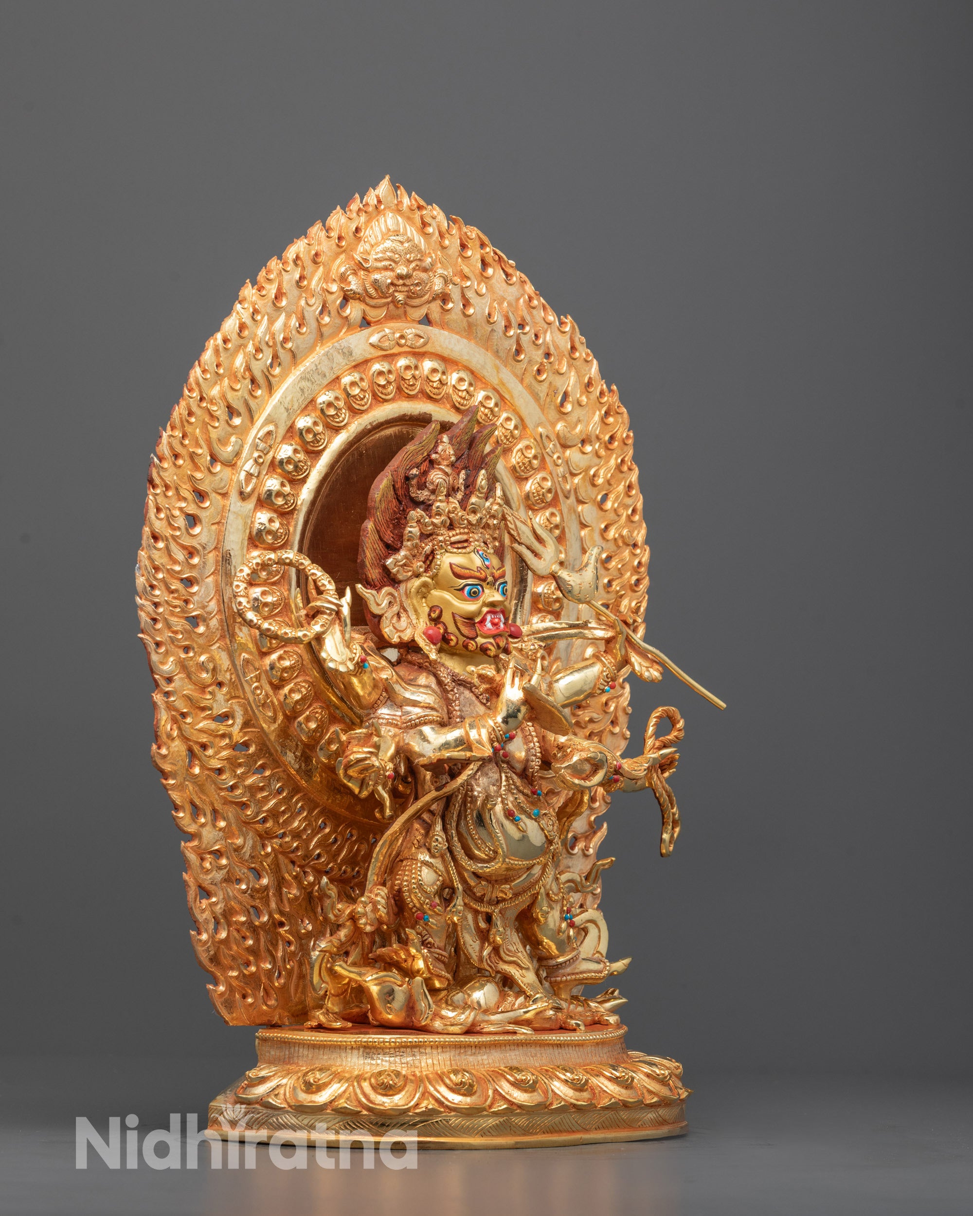 Side view of Traditional Tibetan Six Armed Mahakala Statue featuring a hollow chamber for consecration