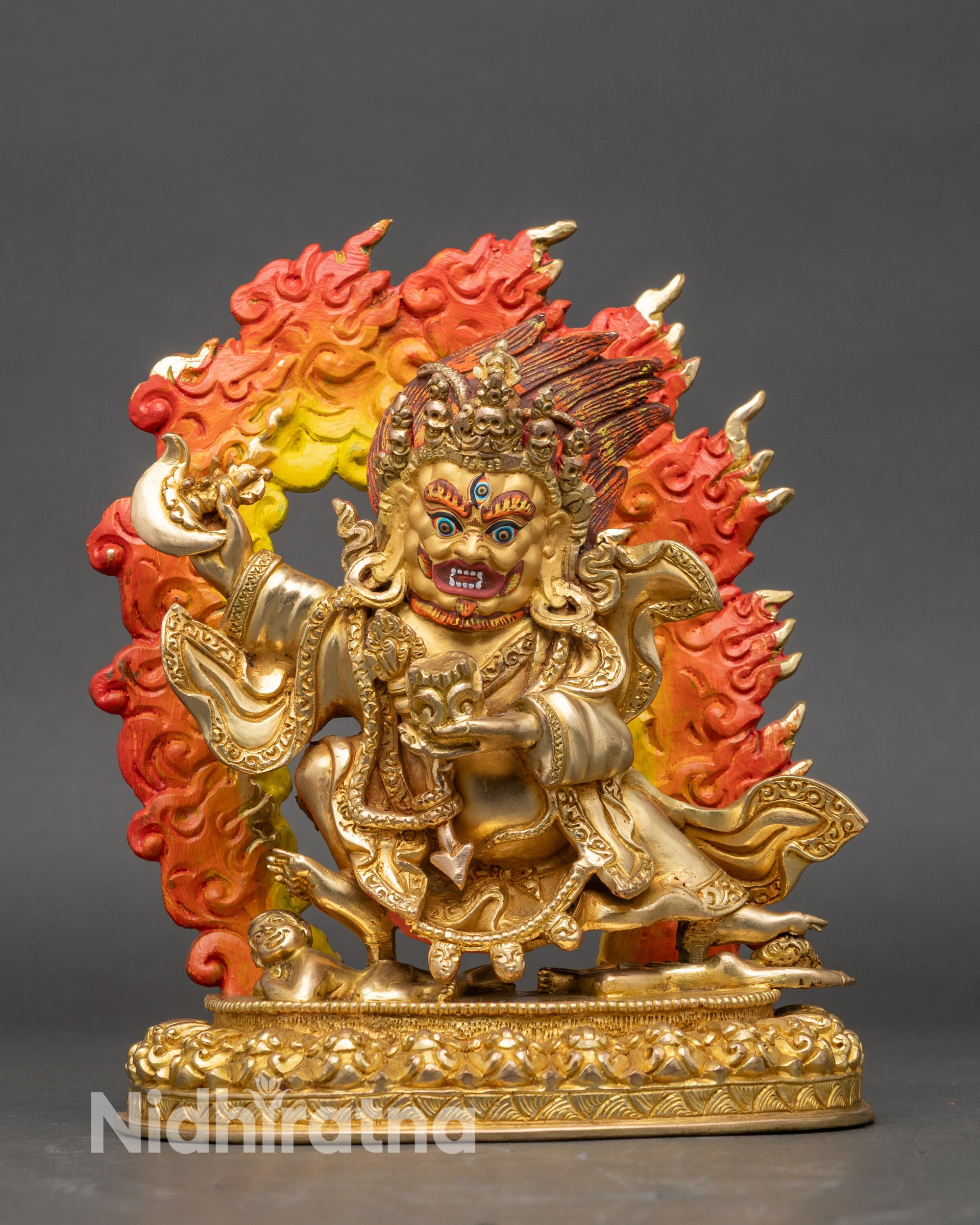 Mahakala Bernagchen statue standing on lotus base with flaying knife and skull cup