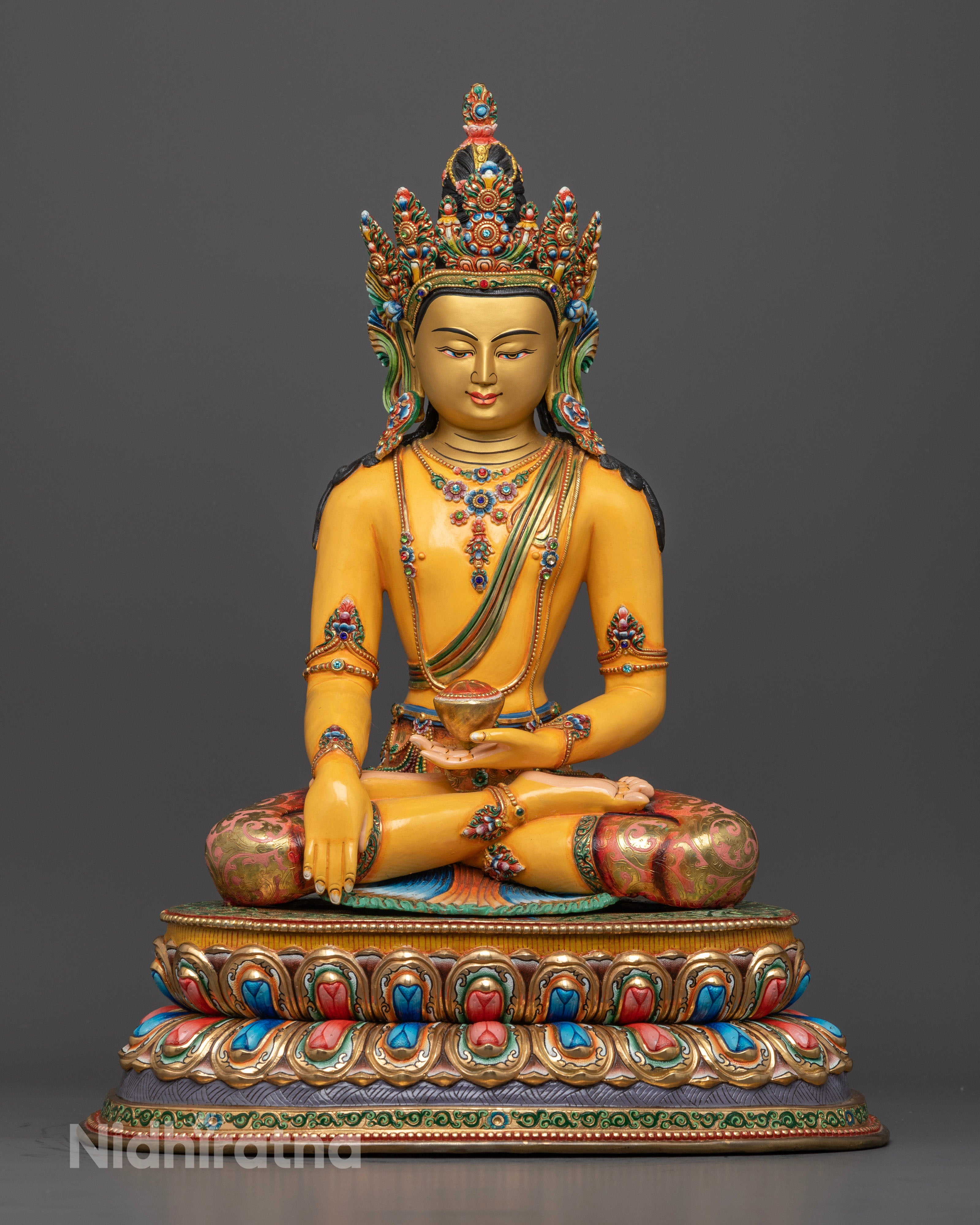 Majestic 48cm tall Buddha Shakyamuni statue handcrafted in Patan, Nepal, made from high-quality copper with a radiant 24k gold-plated face and vibrant acrylic detailing.