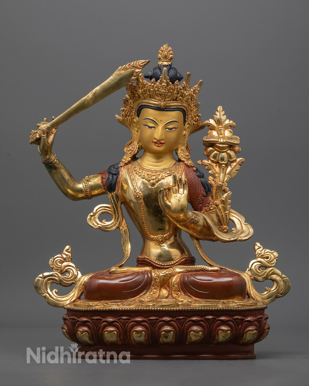 Hand-carved Manjushri Statue in oxidized copper with 24K gold gilding and vibrant acrylic colors