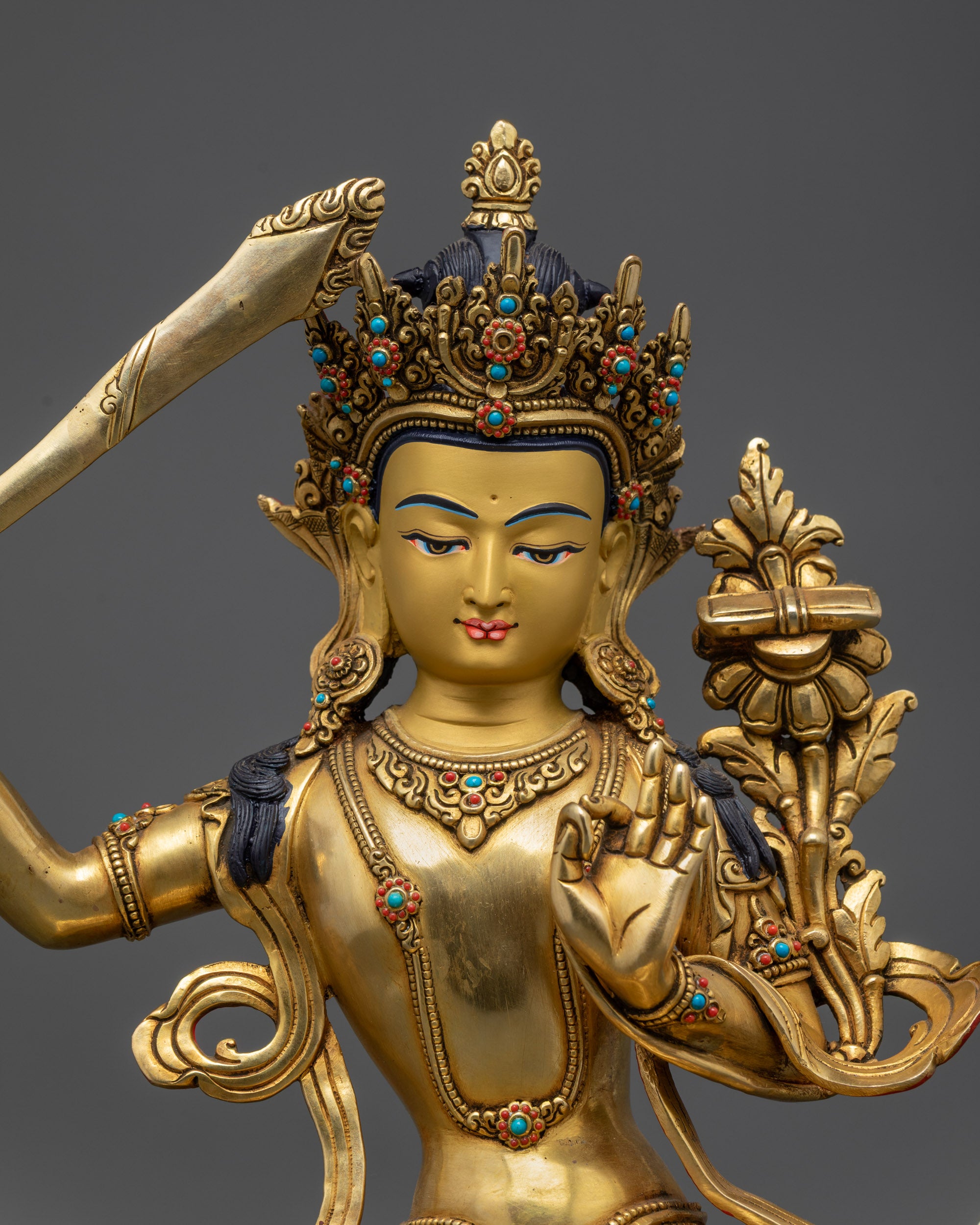 Manjushri Bodhisattva holding sword and utpala flower in Abhaya mudra