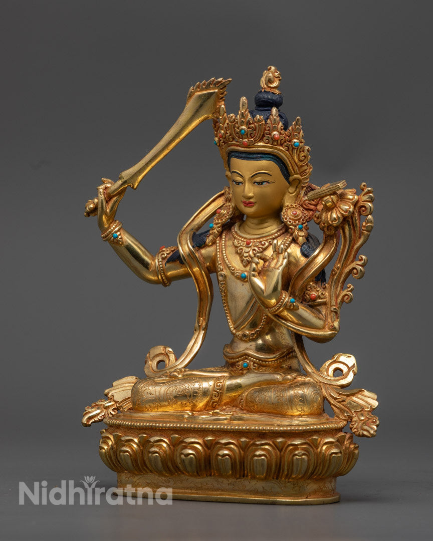 Manjushri Buddha statue highlighting the gold gilded copperwork and traditional Nepalese craftsmanship.