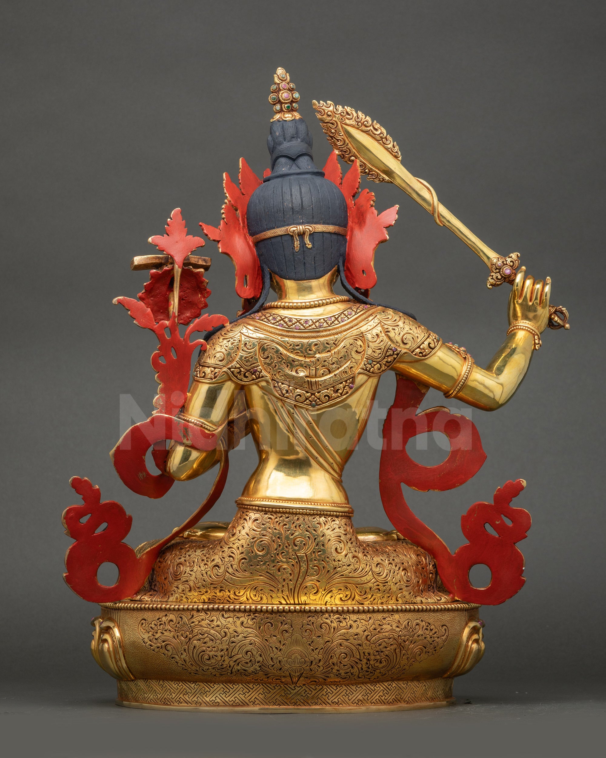 Manjushri Statue back view lotus seat with carved floral and dharma motifs