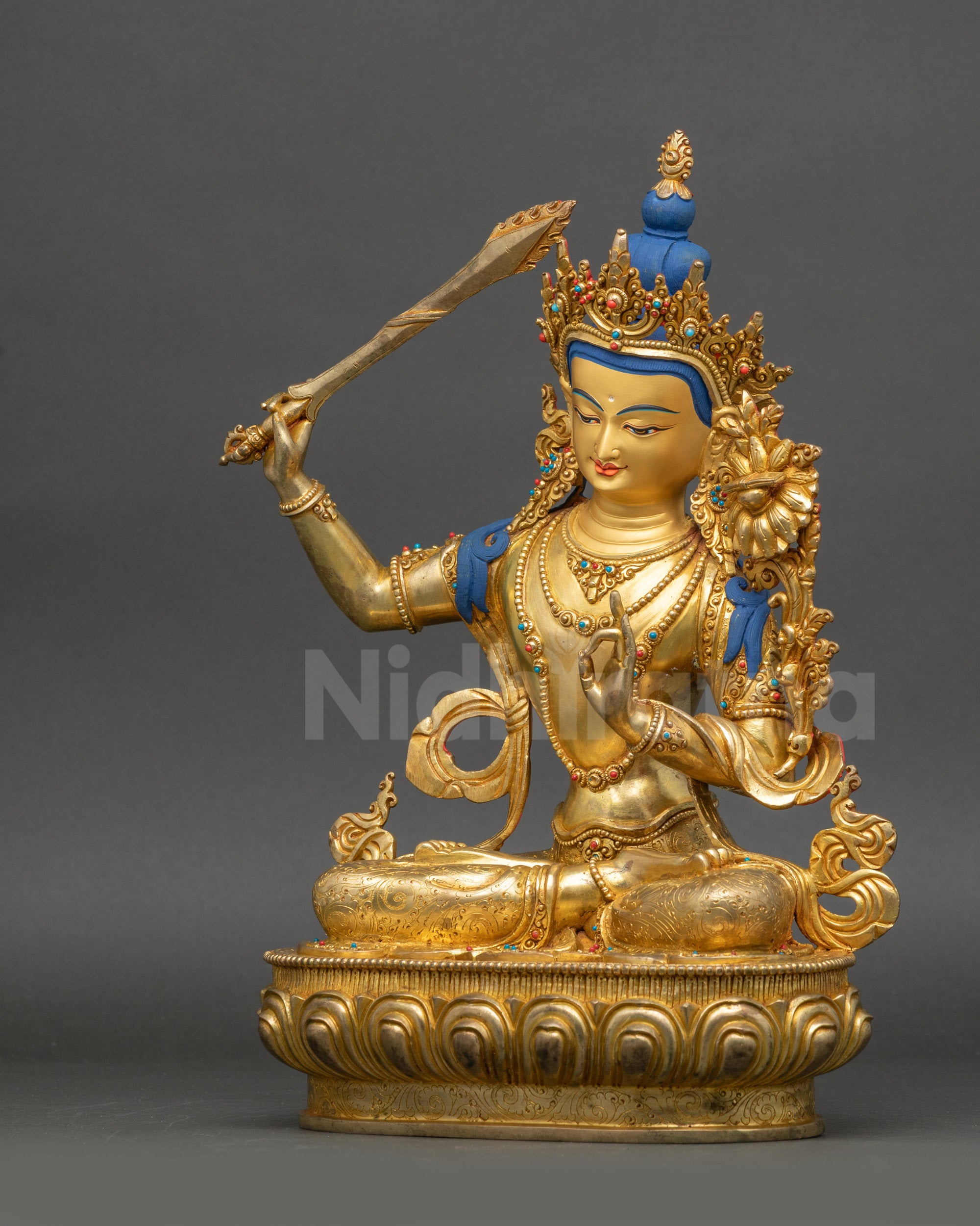 Manjushri Statue left side view detailed carvings on robe and lotus seat