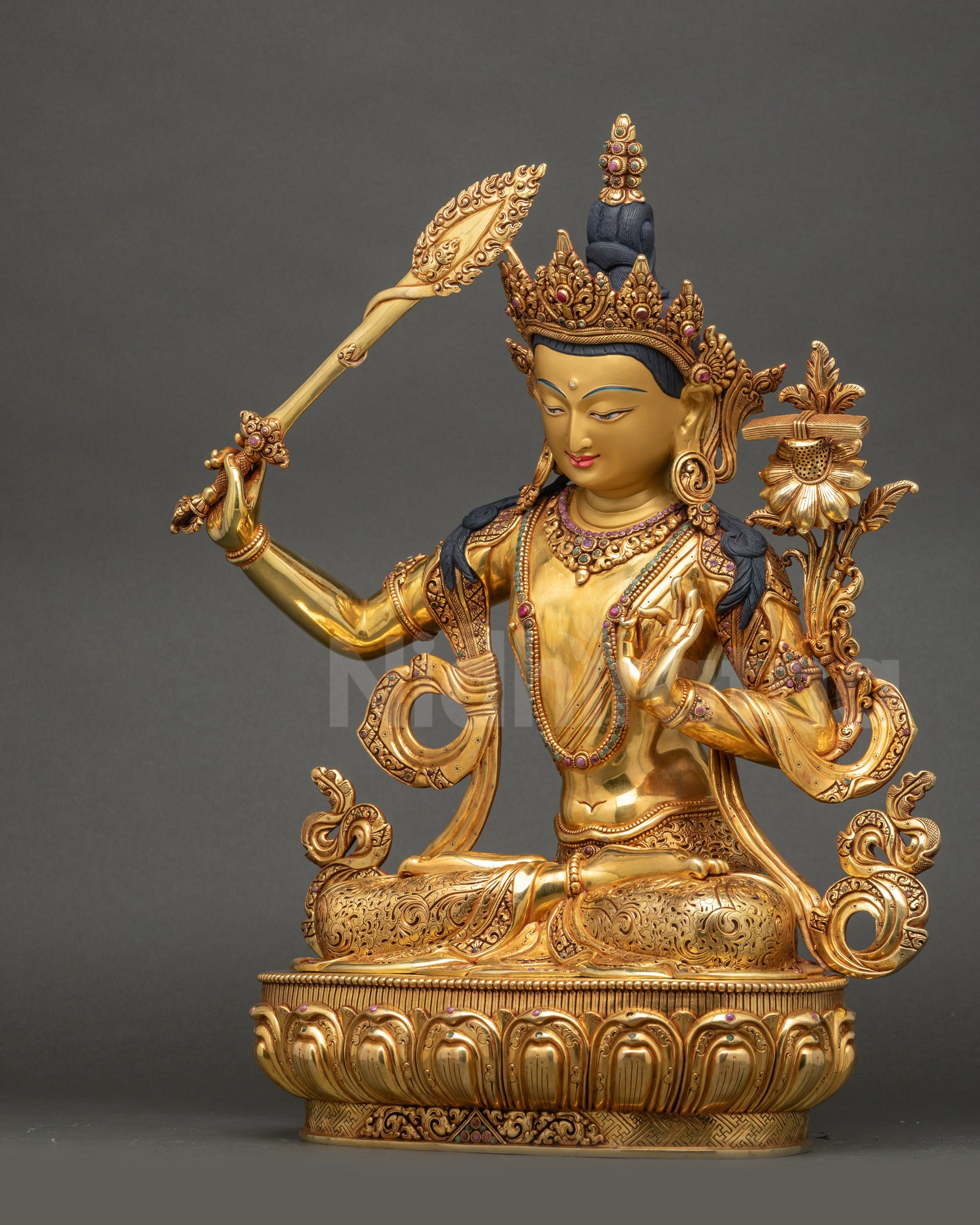 Manjushri Statue left side view intricate robes and lotus base Nepal