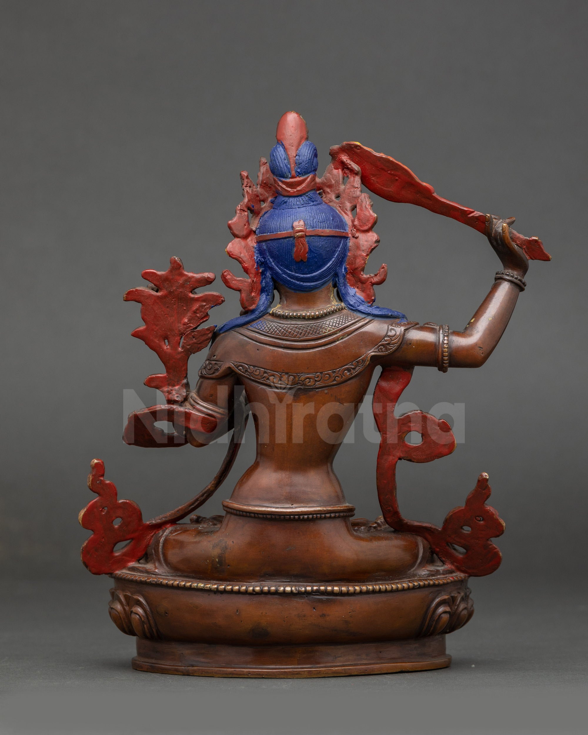Manjushri Statue oxidized copper adorned with stones back view
