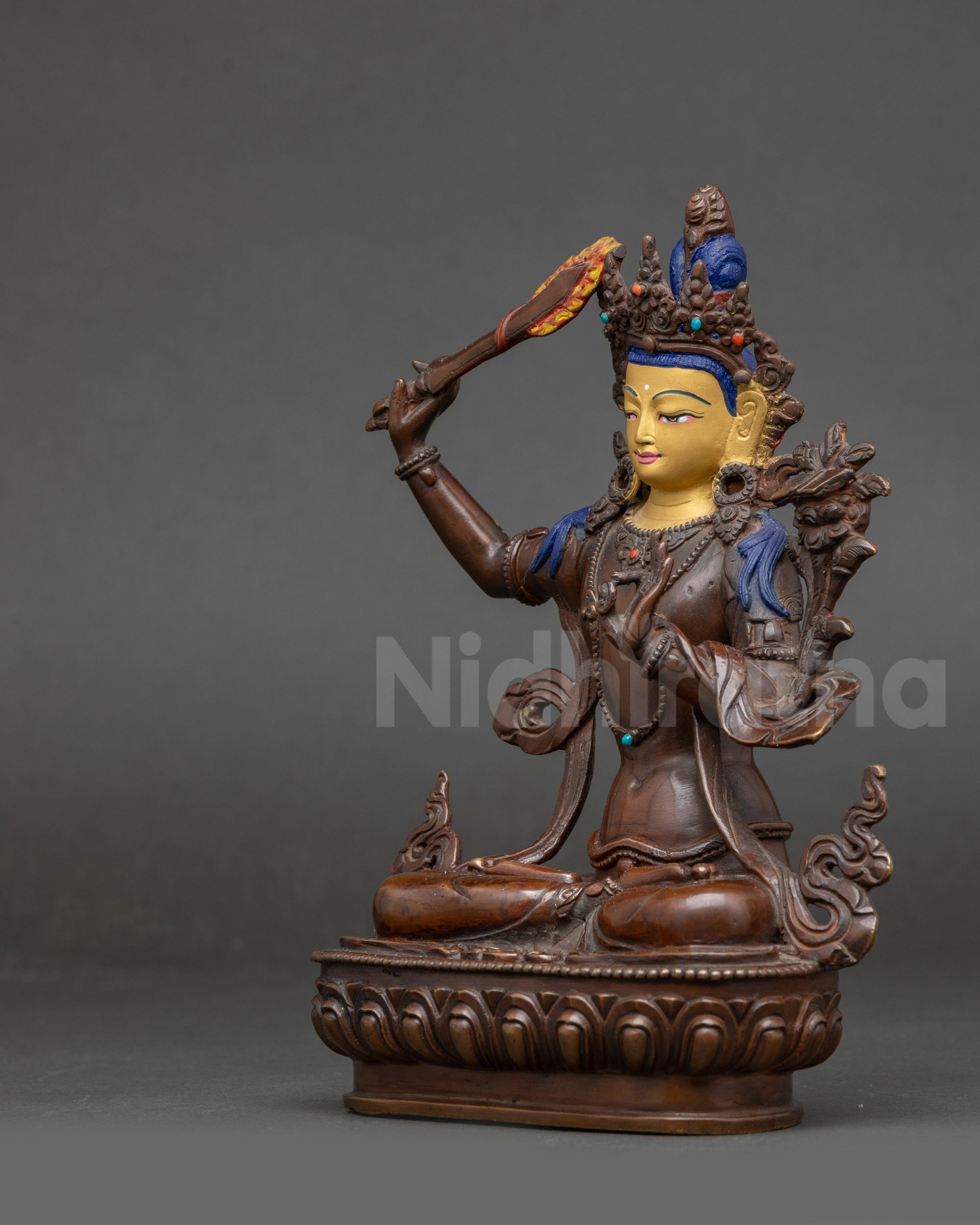 Manjushri Statue oxidized copper utpala flower left view side
