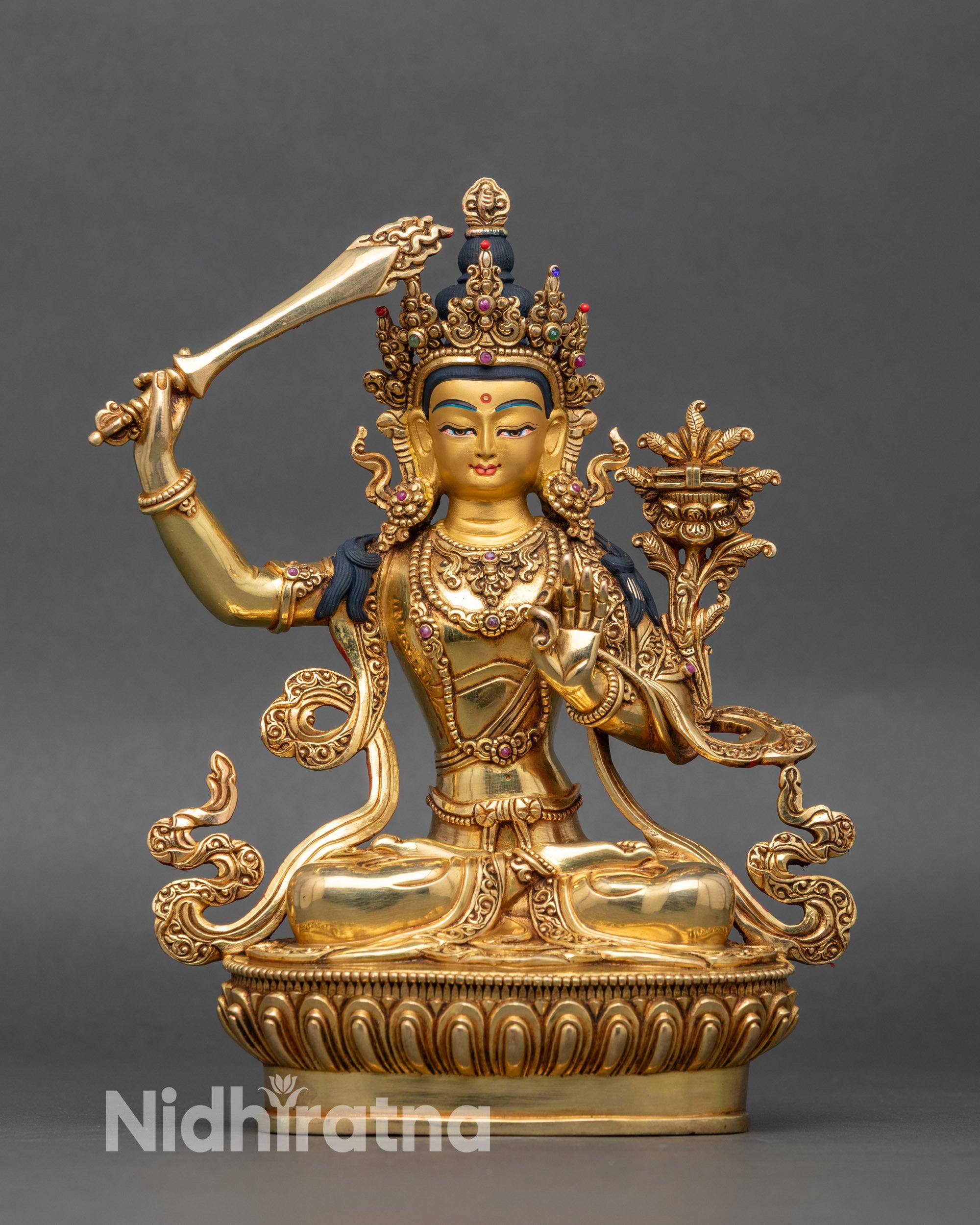Manjushri Wisdom Deity statue front view, gold-painted face, Buddhist altar decor