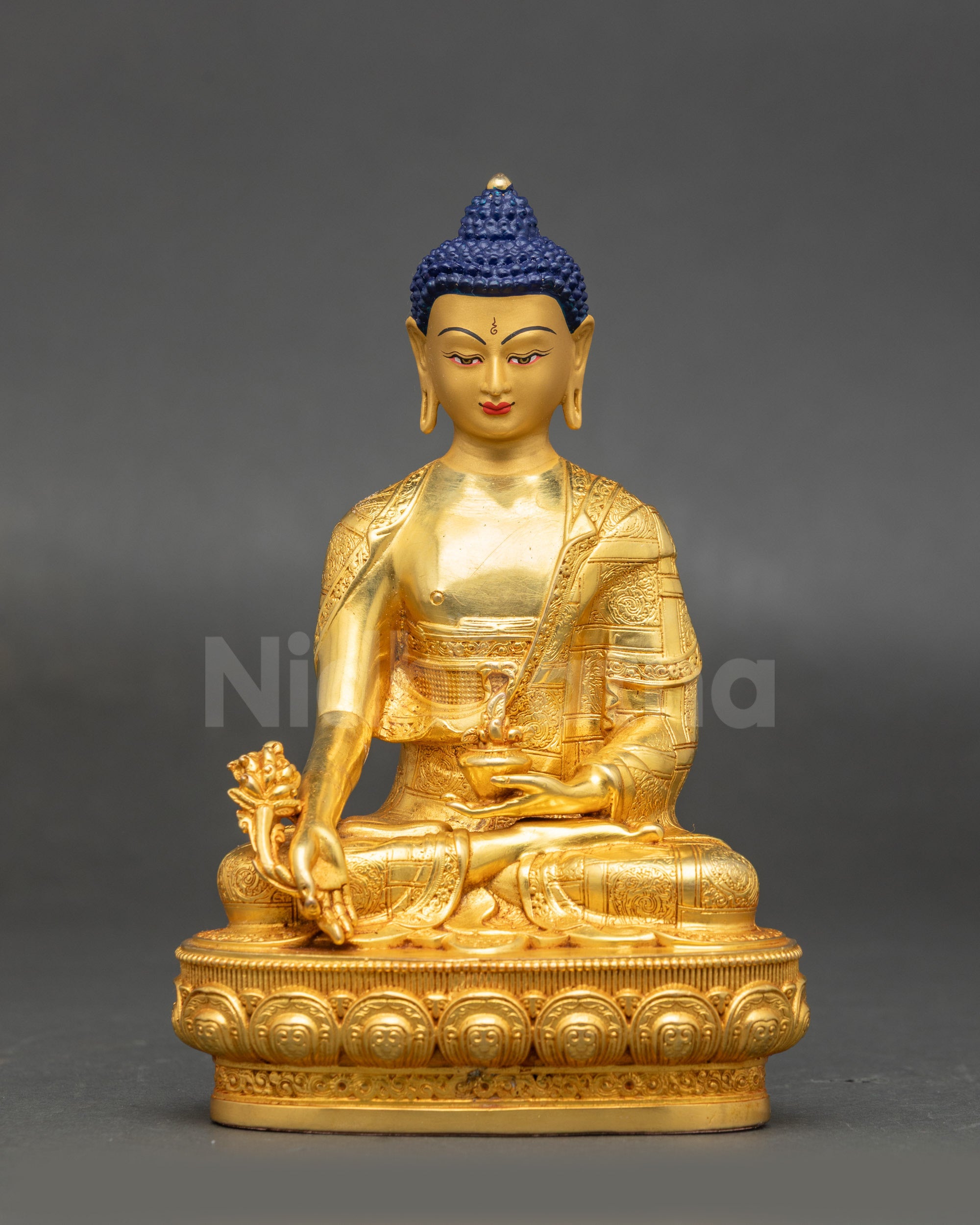 Medicine Buddha Sculpture from Nepal seated on lotus holding myrobalan vase and stem with gold-painted face