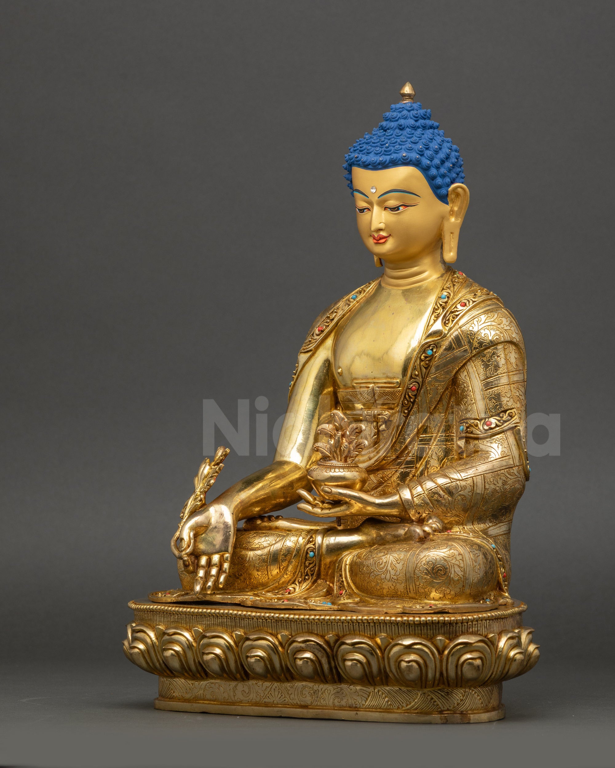 Medicine Buddha statue left side view copper and gold fire-gilded details