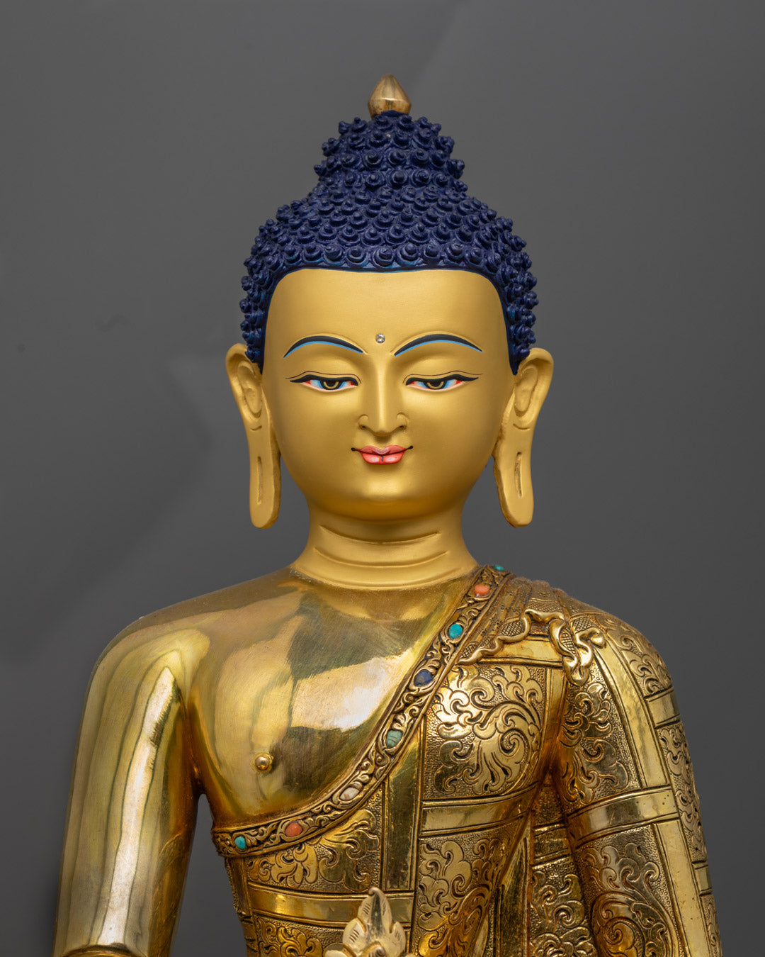 Medicine Buddha statue showing detailed facial expression and sacred bowl of healing nectar, handcrafted in Nepal.