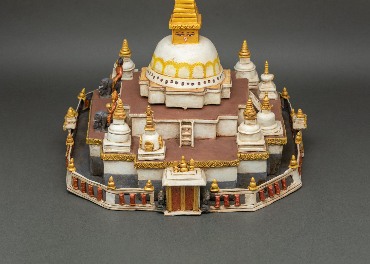 Mini Boudha Stupa statue showing 16-sided mandala base and stair entrance