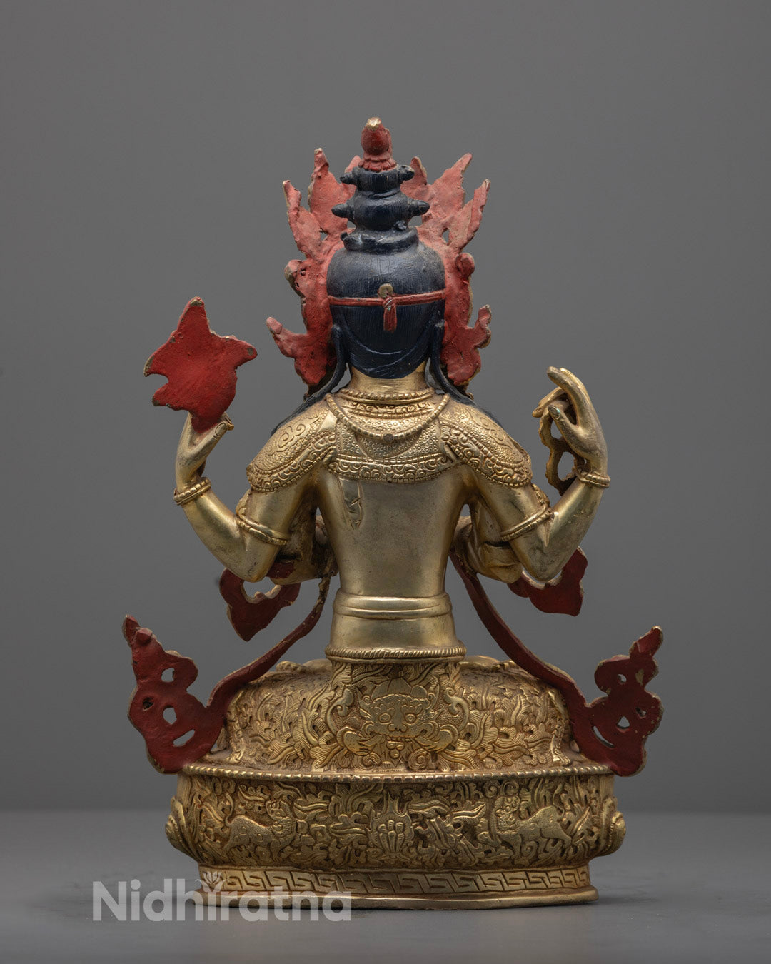 Nepal artisan handcrafting Chenrezig Statue with fire-gilding.
